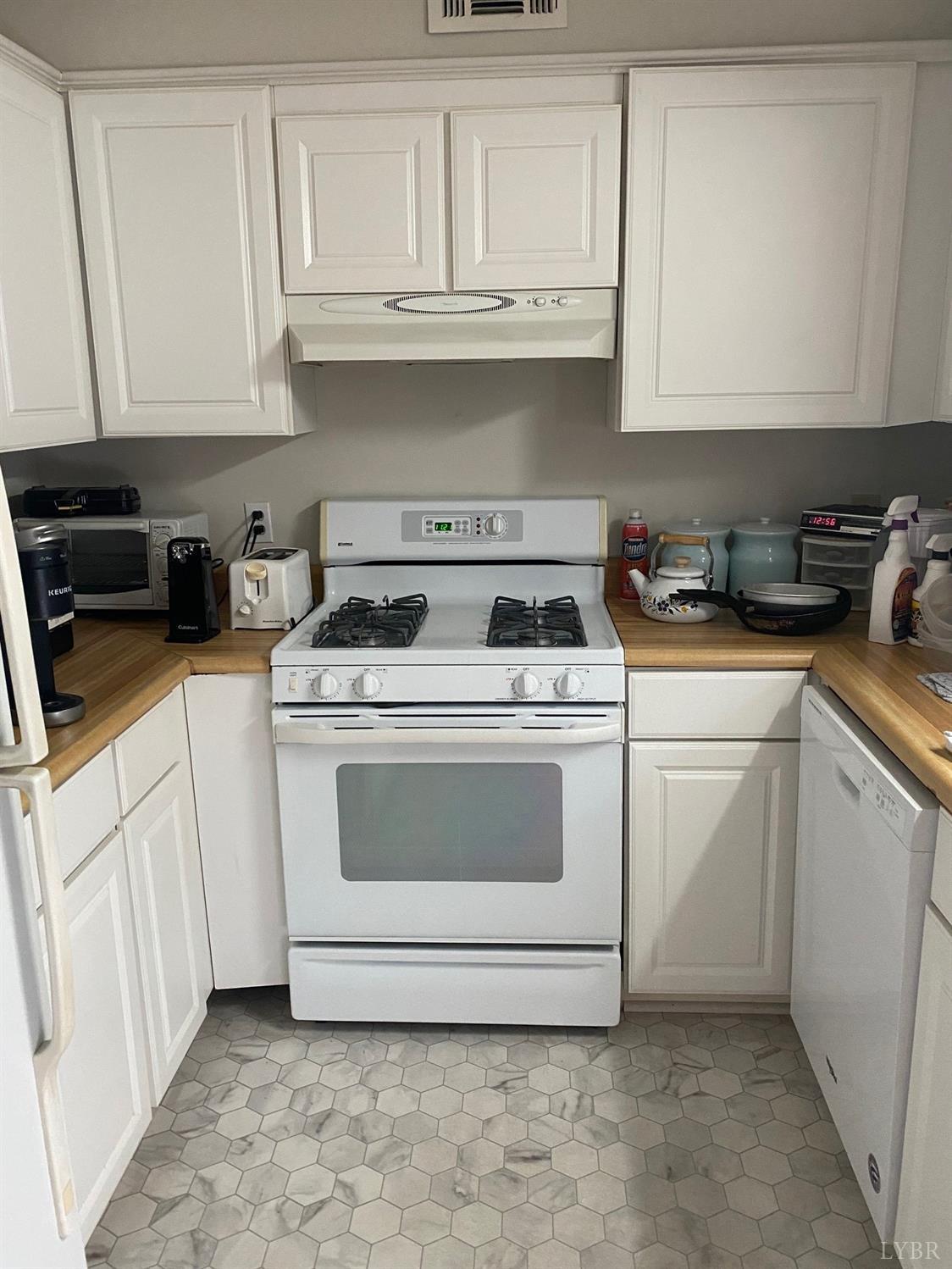 3501 Fort Avenue, Unit 29 Lynchburg, VA 24501 - Photo 5 of 16 a kitchen with white cabinets and white appliances