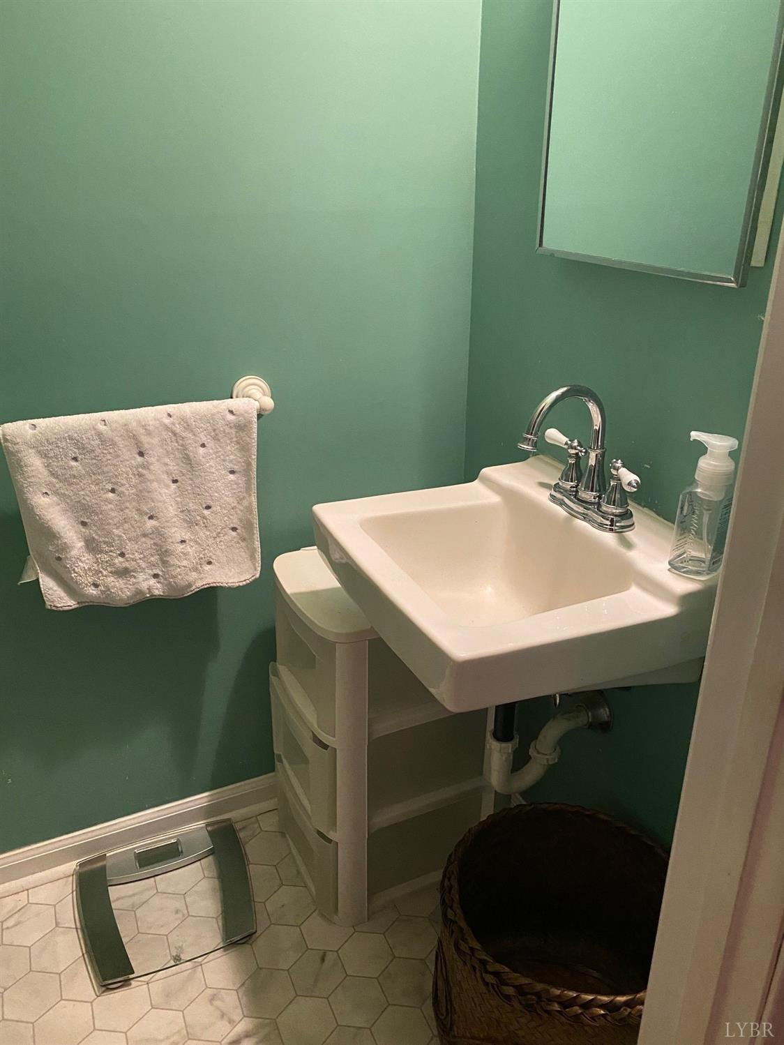 3501 Fort Avenue, Unit 29 Lynchburg, VA 24501 - Photo 8 of 16 a bathroom with a sink and a mirror
