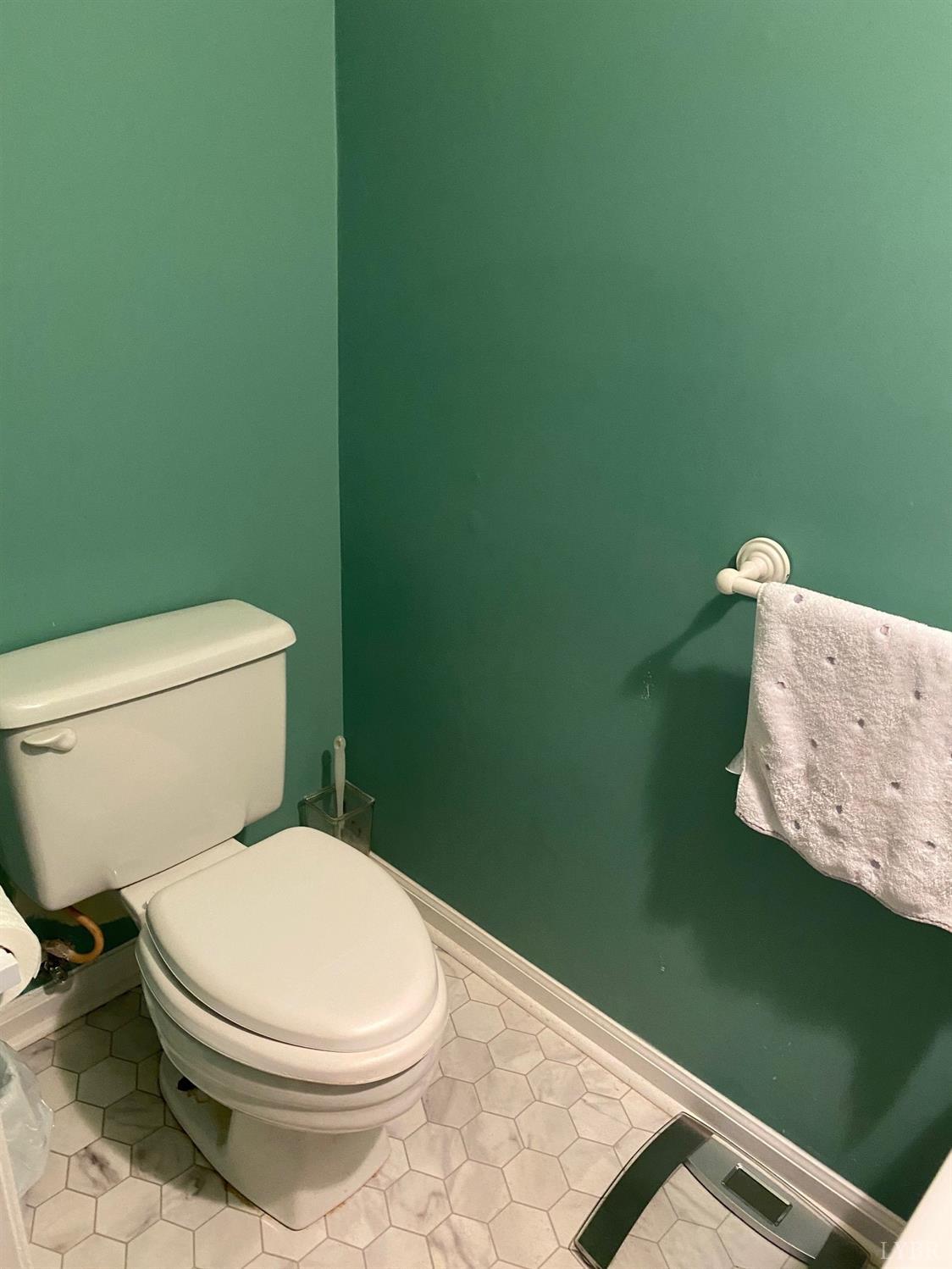 3501 Fort Avenue, Unit 29 Lynchburg, VA 24501 - Photo 9 of 16 a white toilet sitting next to a white wall