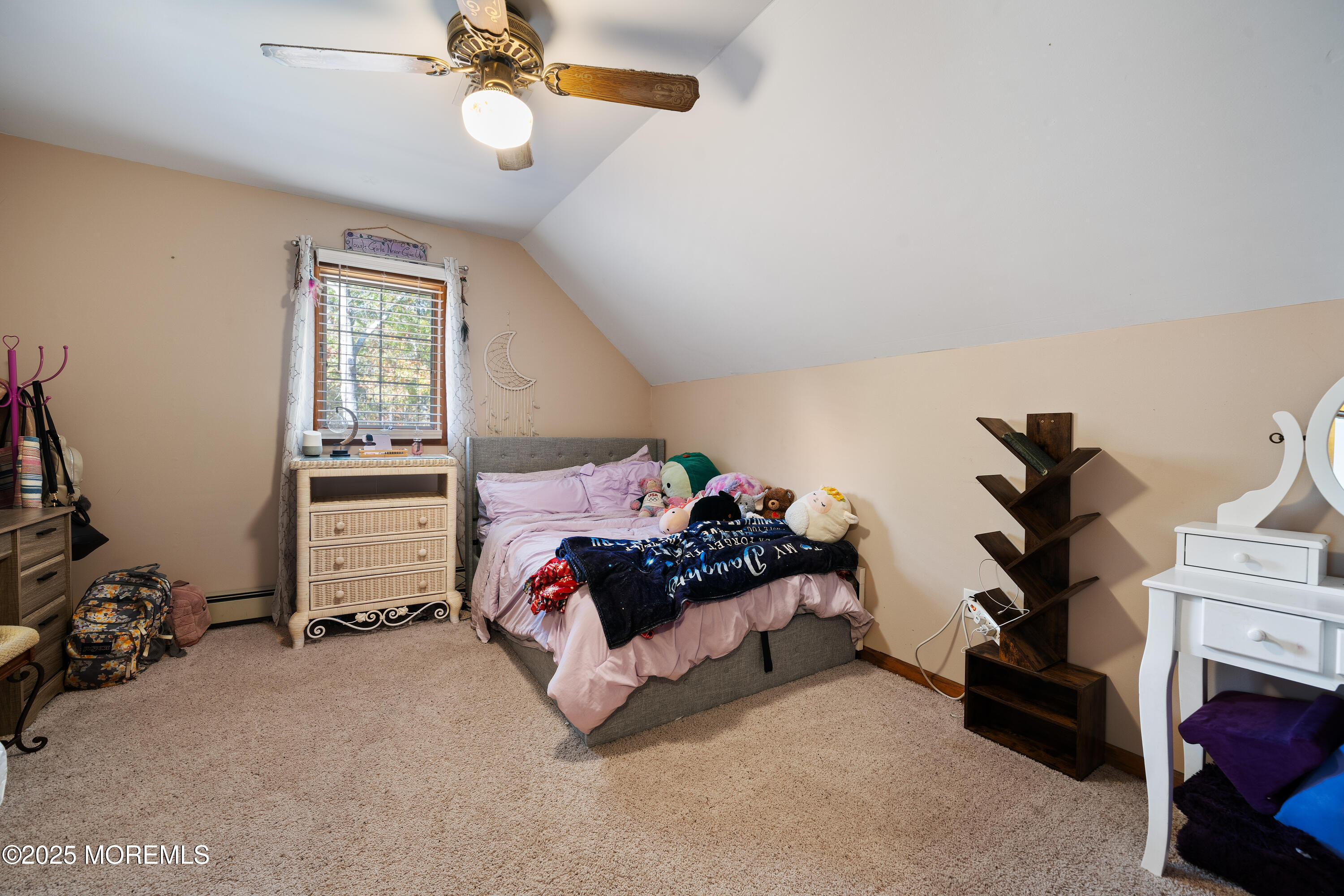 1226 Andover Road Forked River, NJ 08731 - Photo 23 of 44 a bedroom with bed and a chandelier