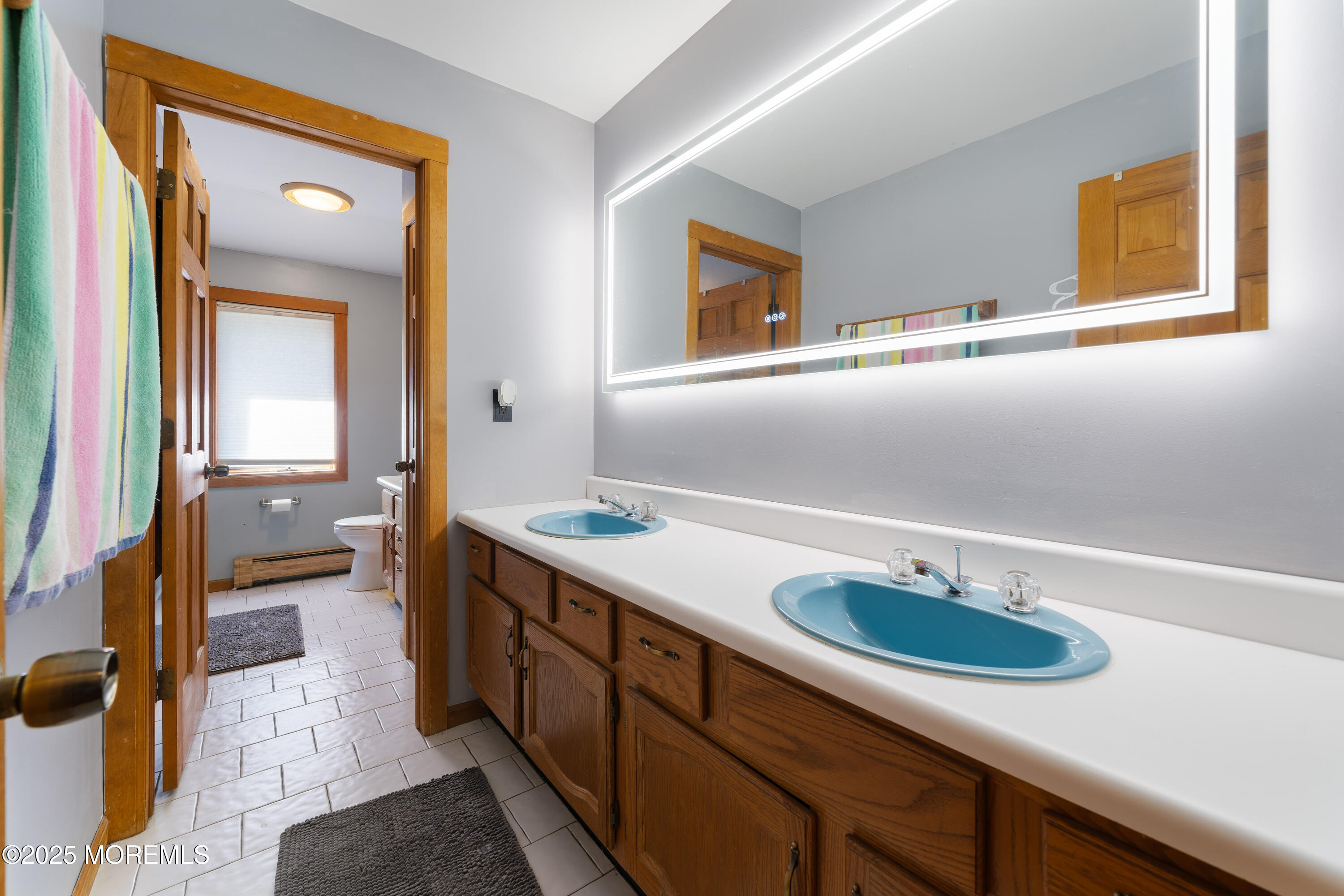 1226 Andover Road Forked River, NJ 08731 - Photo 25 of 44 a bathroom with a sink and a mirror