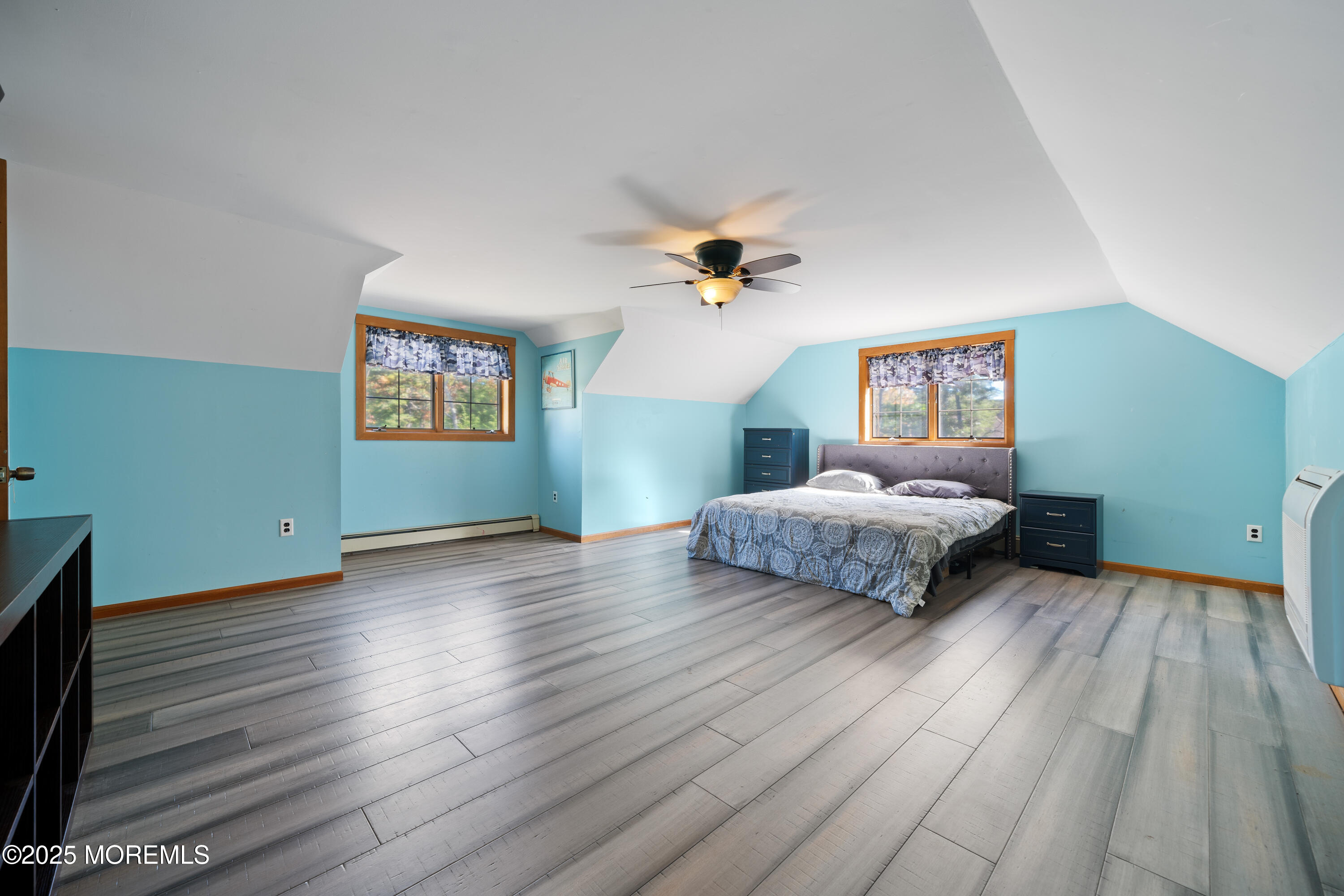1226 Andover Road Forked River, NJ 08731 - Photo 28 of 44 a bedroom with a bed and a chandelier