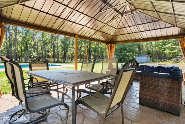 a patio view with a table and chairs