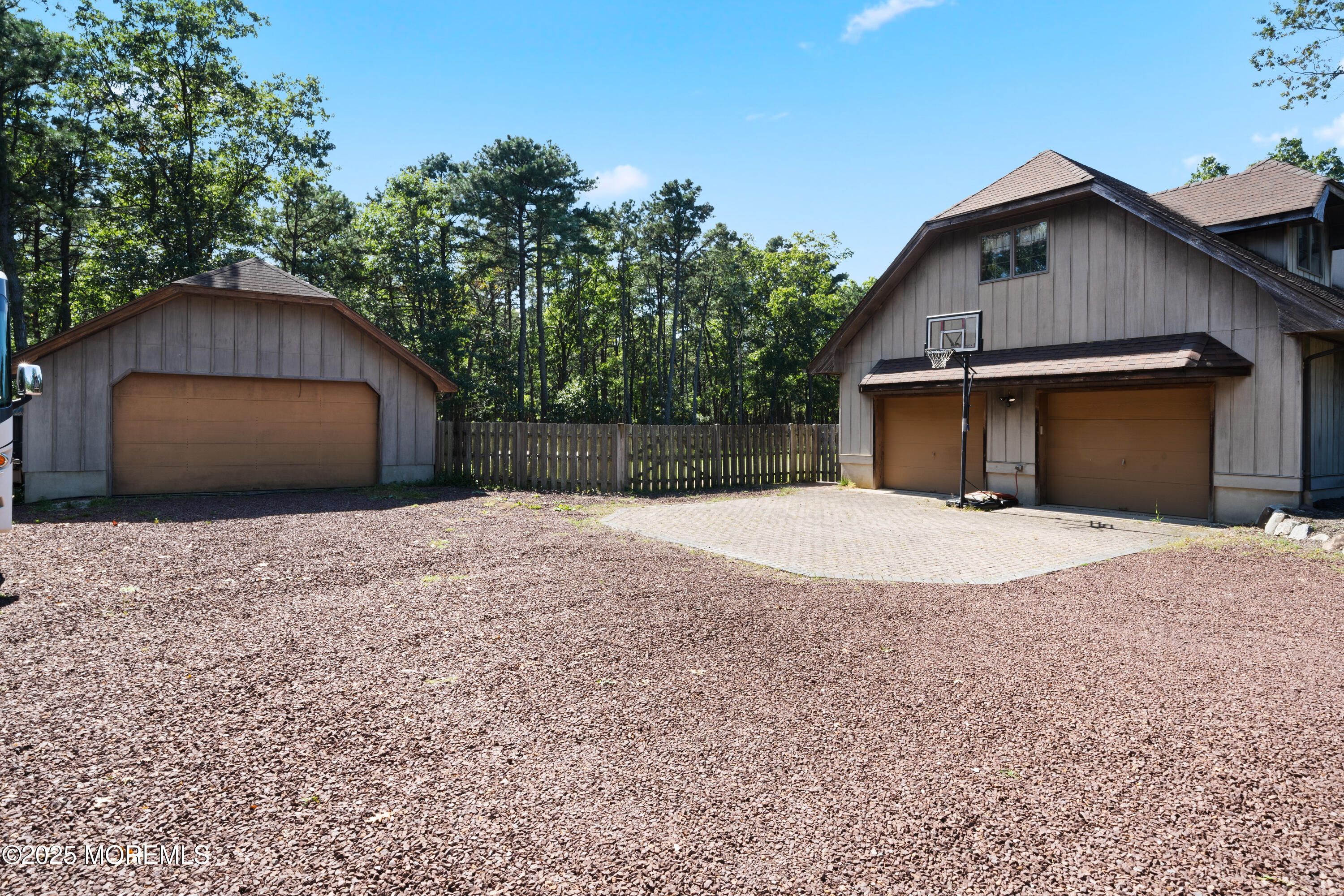 1226 Andover Road Forked River, NJ 08731 - Photo 5 of 44 a front view of a house with a yard and garage