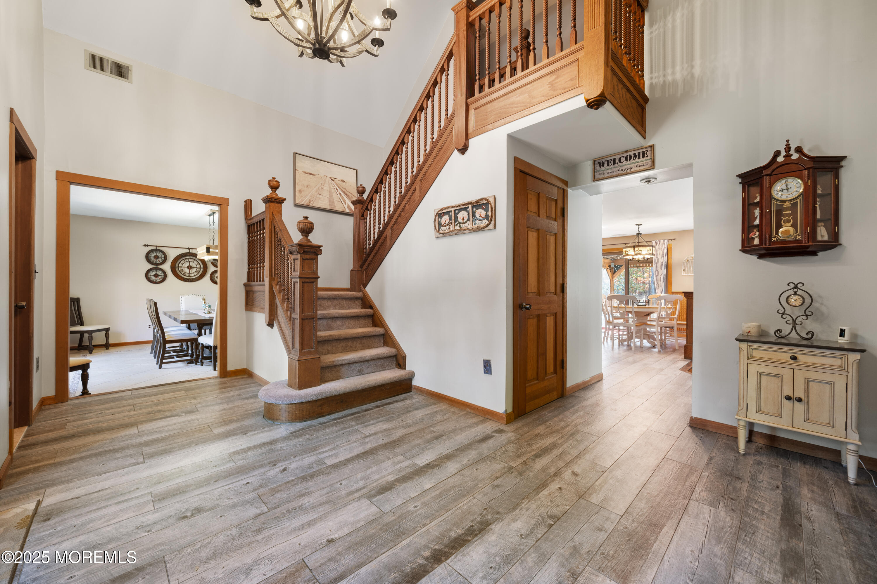 1226 Andover Road Forked River, NJ 08731 - Photo 6 of 44 a view of a hallway view with wooden floor and staircase