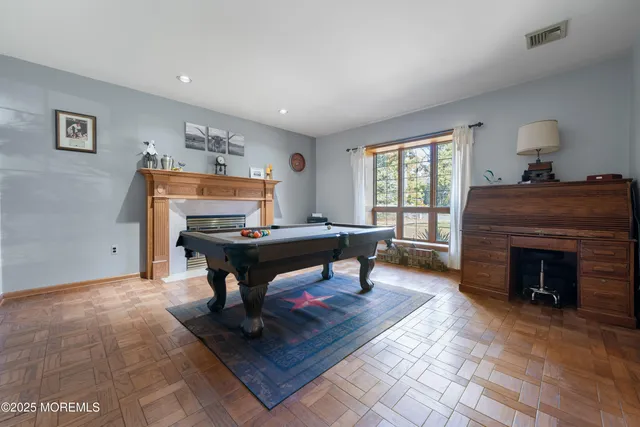 a living room with furniture a window and a fireplace