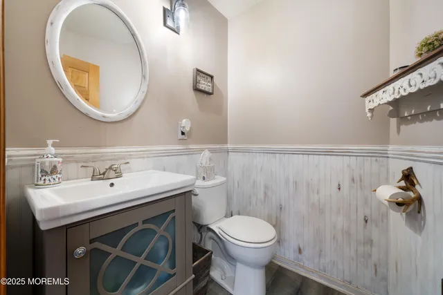 a bathroom with a sink a mirror and a toilet