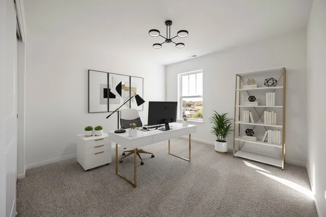 a view of a workspace with a window and lounge chair