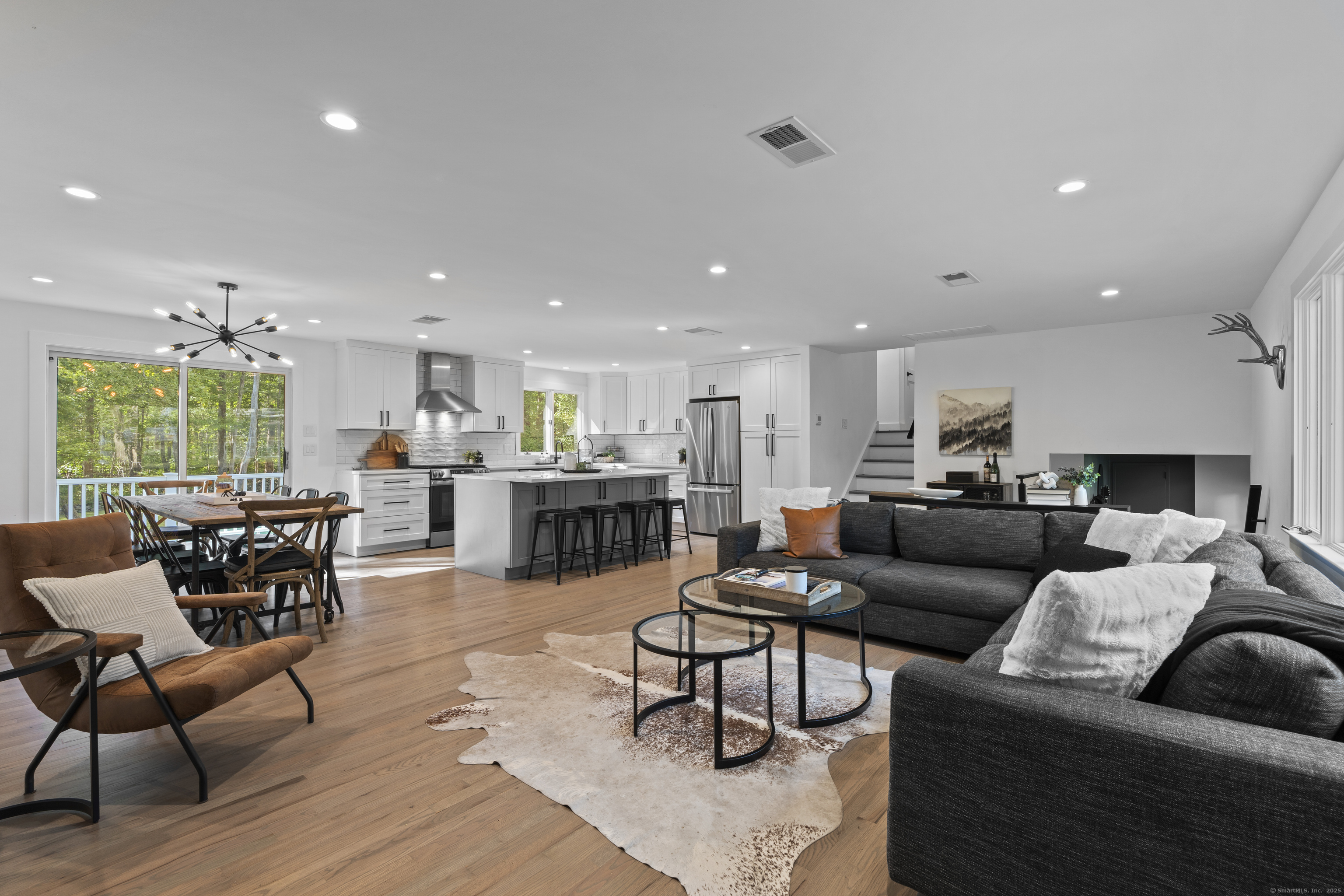 Welcome to 69 Squires Rd. The main level opens up to the living room with a cozy fireplace, dining area and amazing kitchen. This is truly the heart of this home.