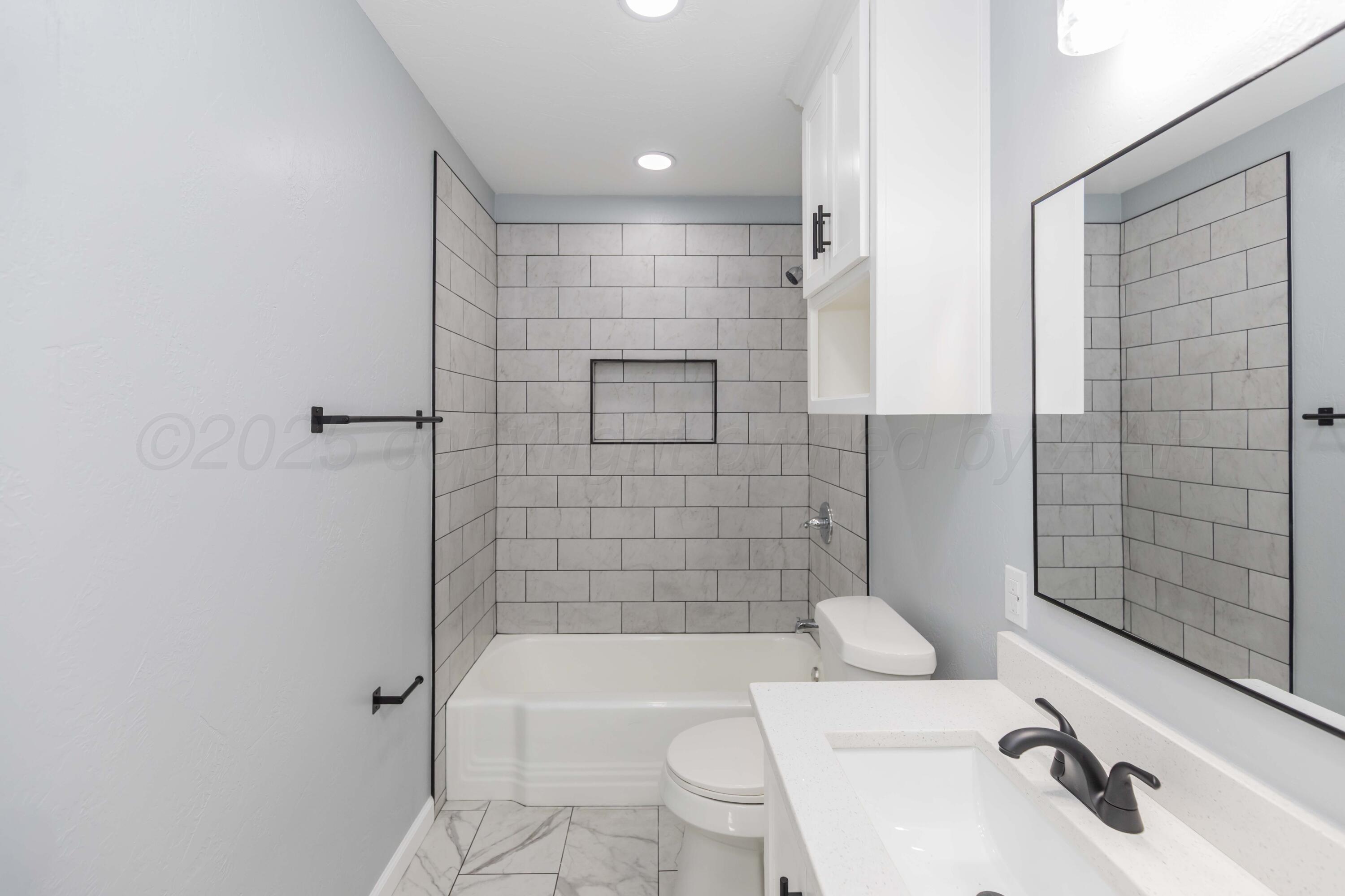 3108 Oak Drive Amarillo, TX 79107 - Photo 14 of 35 a bathroom with a sink toilet and shower
