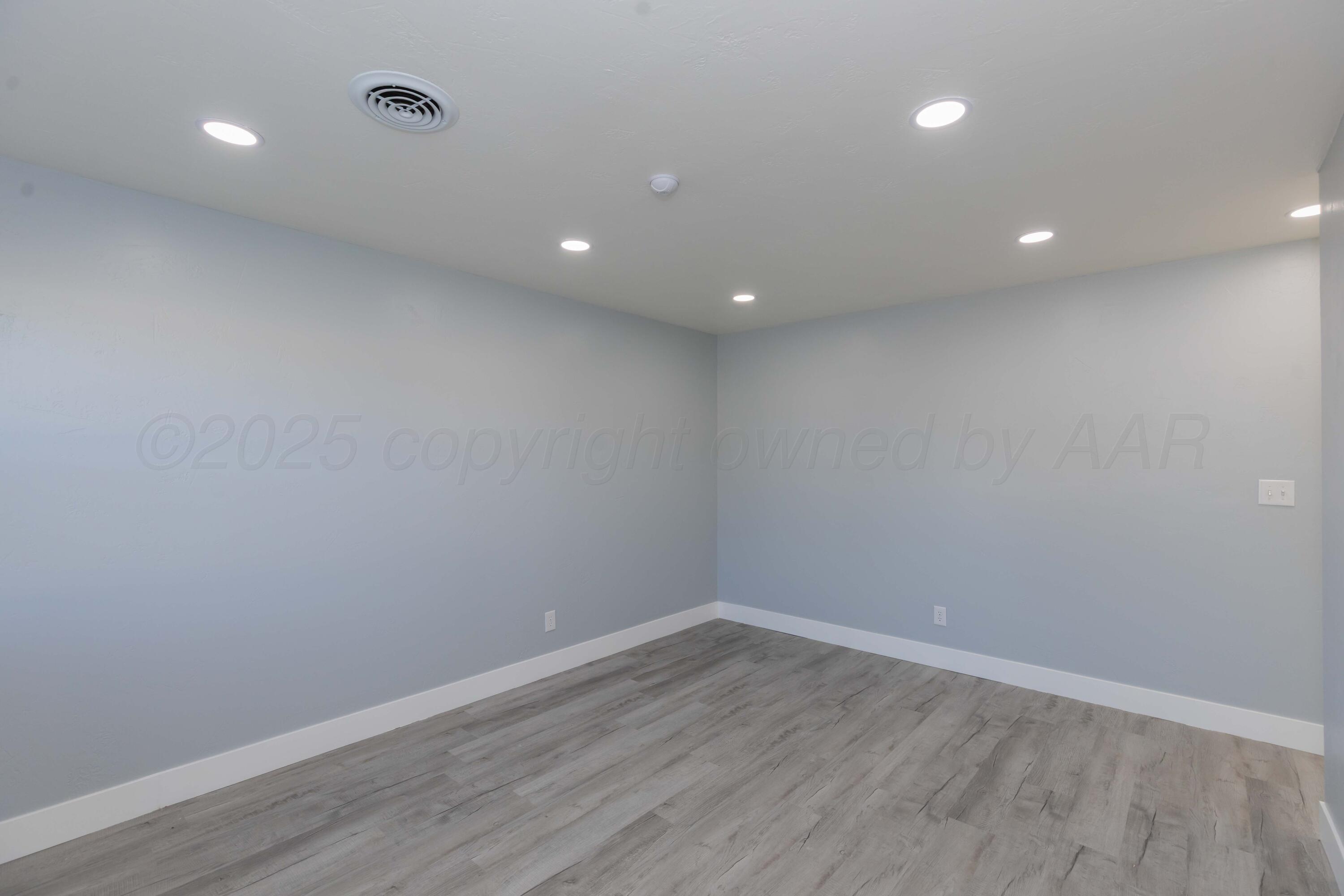 3108 Oak Drive Amarillo, TX 79107 - Photo 22 of 35 a view of empty room with wooden floor and fan