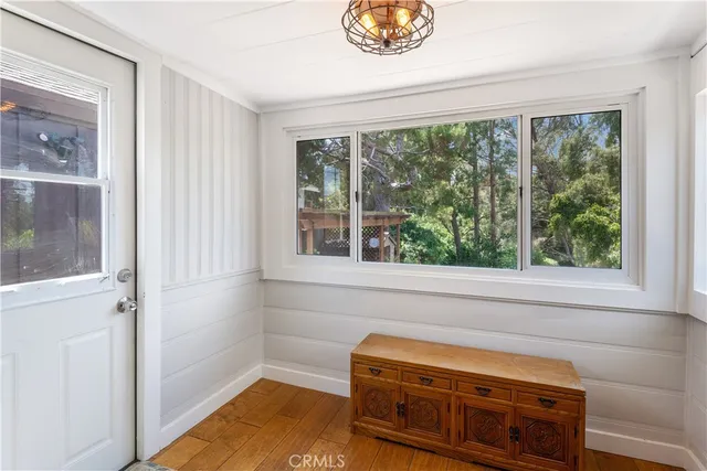 a bedroom with a bed a couch and a dresser