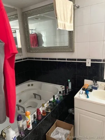 a utility room with sink dryer and washer