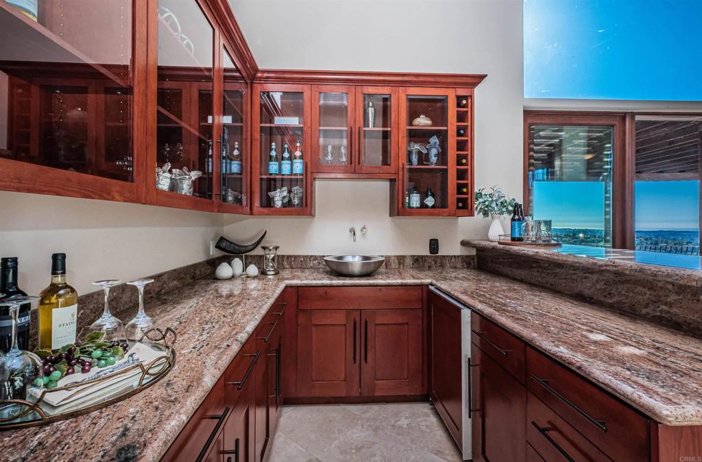 2362 Edgehill Road Vista, CA 92084 - Photo 17 of 63 a kitchen with stainless steel appliances granite countertop a sink stove and cabinets