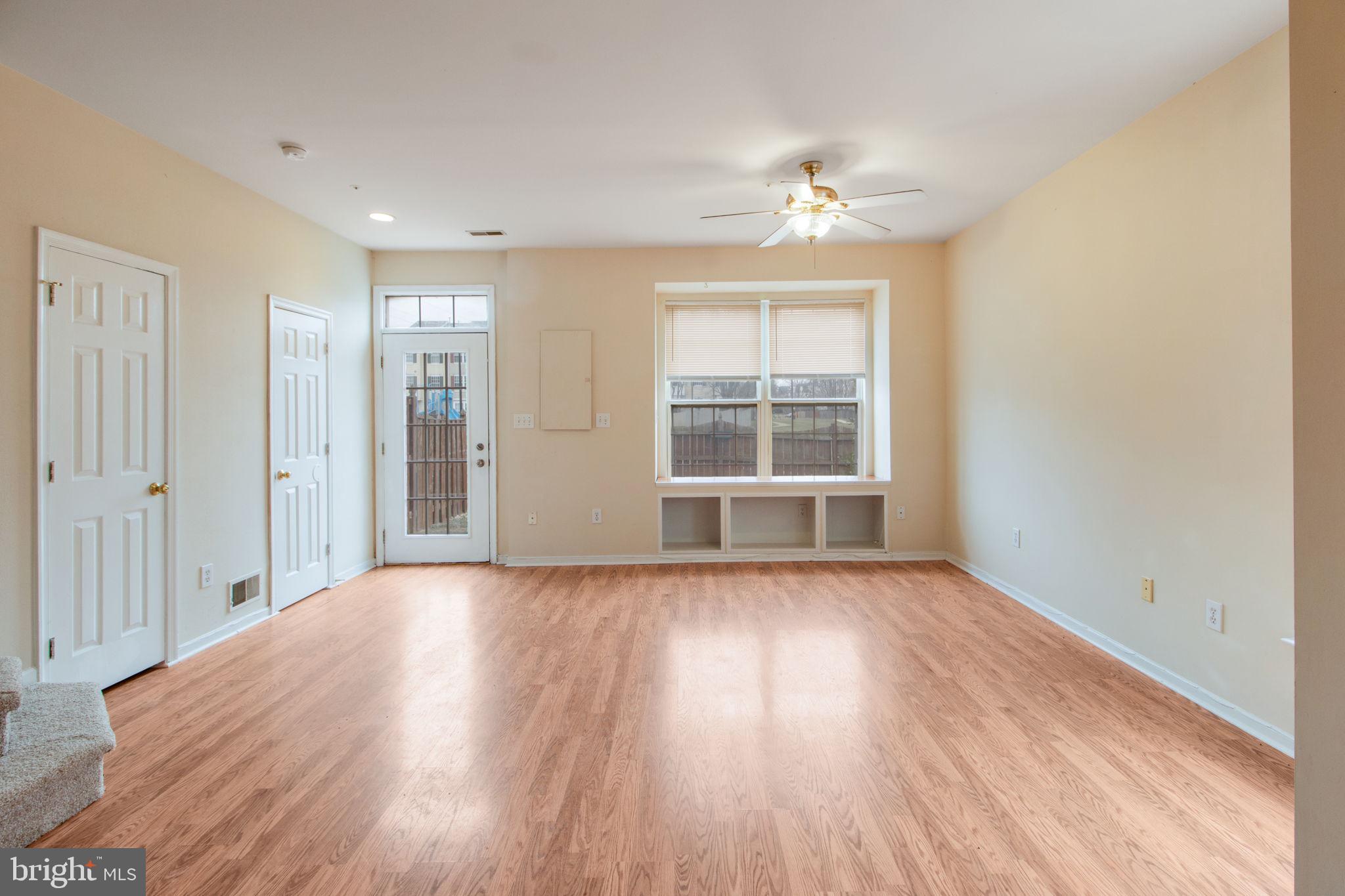 5171 Duke Court Frederick, MD 21703 - Photo 11 of 26 a view of an empty room with wooden floor and a window
