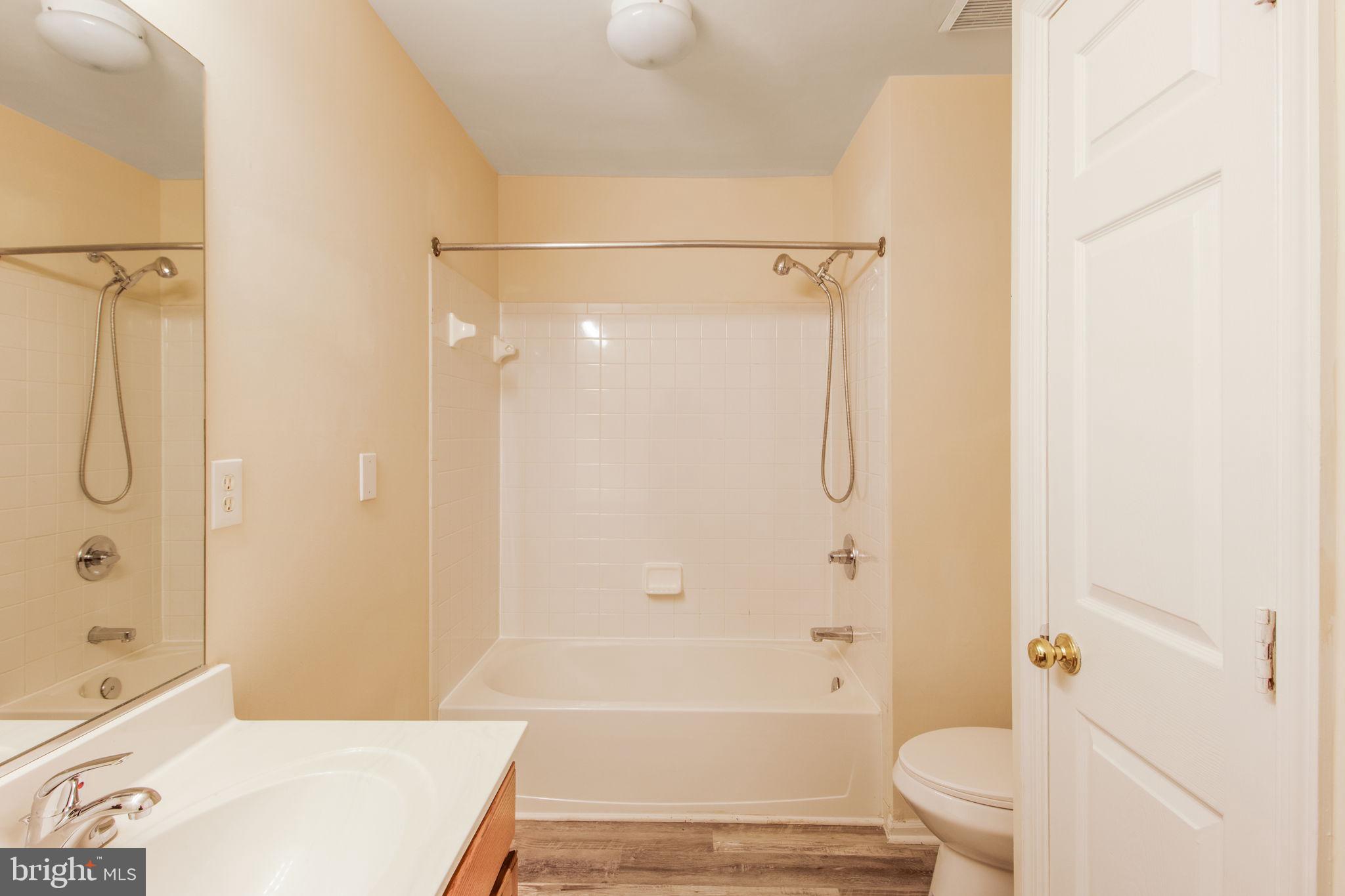 5171 Duke Court Frederick, MD 21703 - Photo 17 of 26 a bathroom with a shower a bathtub and toilet