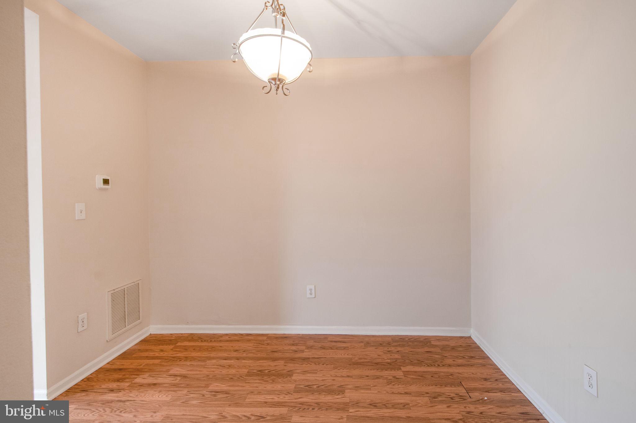 5171 Duke Court Frederick, MD 21703 - Photo 8 of 26 a view of an empty room with wooden floor