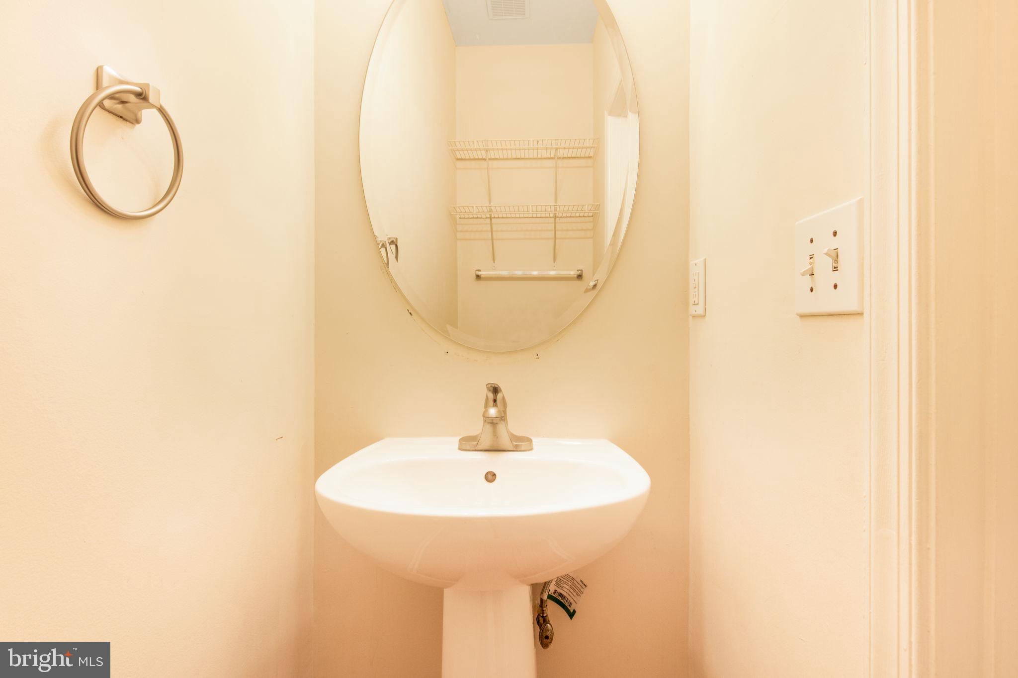 5171 Duke Court Frederick, MD 21703 - Photo 10 of 26 a bathroom with a sink and a mirror