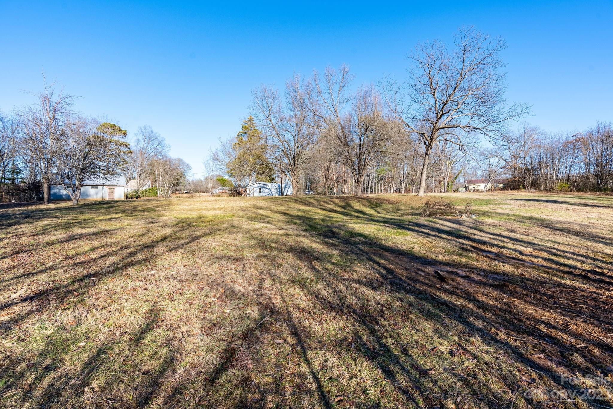 215 Cape Hickory Road Hickory, NC 28601 - Photo 17 of 34 a view of a yard with trees in the background
