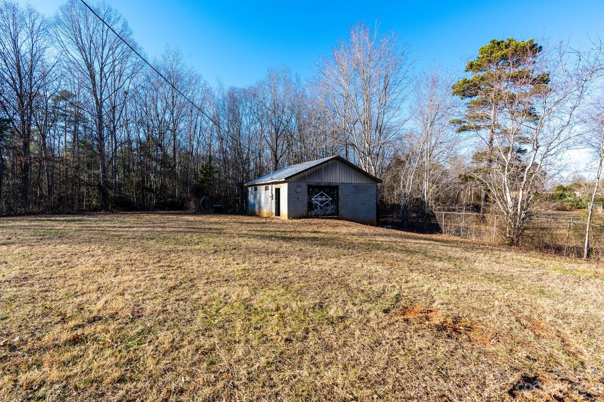 215 Cape Hickory Road Hickory, NC 28601 - Photo 9 of 34 a backyard of house with large trees