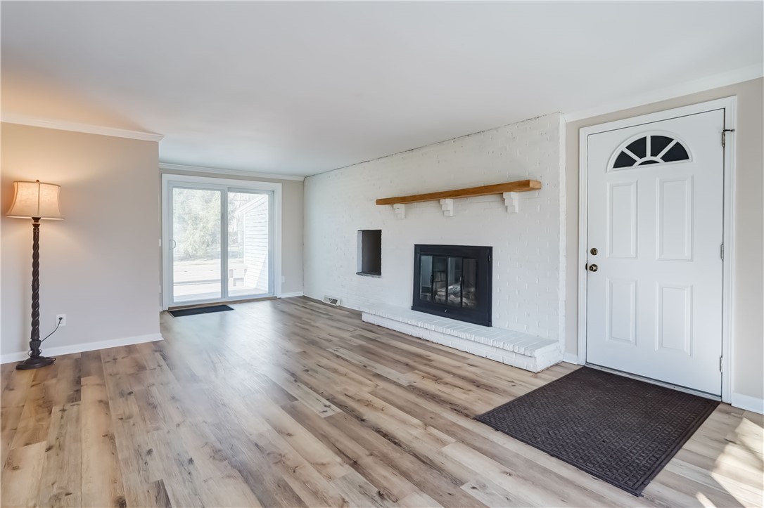 232 Ayrault Road Perinton, NY 14450 - Photo 15 of 36 Family room with sliding door to the deck and acce