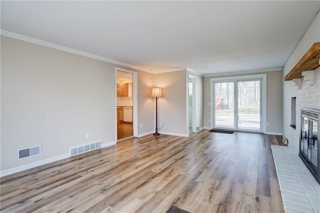 232 Ayrault Road Perinton, NY 14450 - Photo 16 of 36 Spacious family room w/LVP flooring.