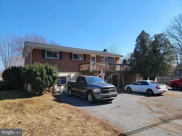 a view of a car parked in front of a house