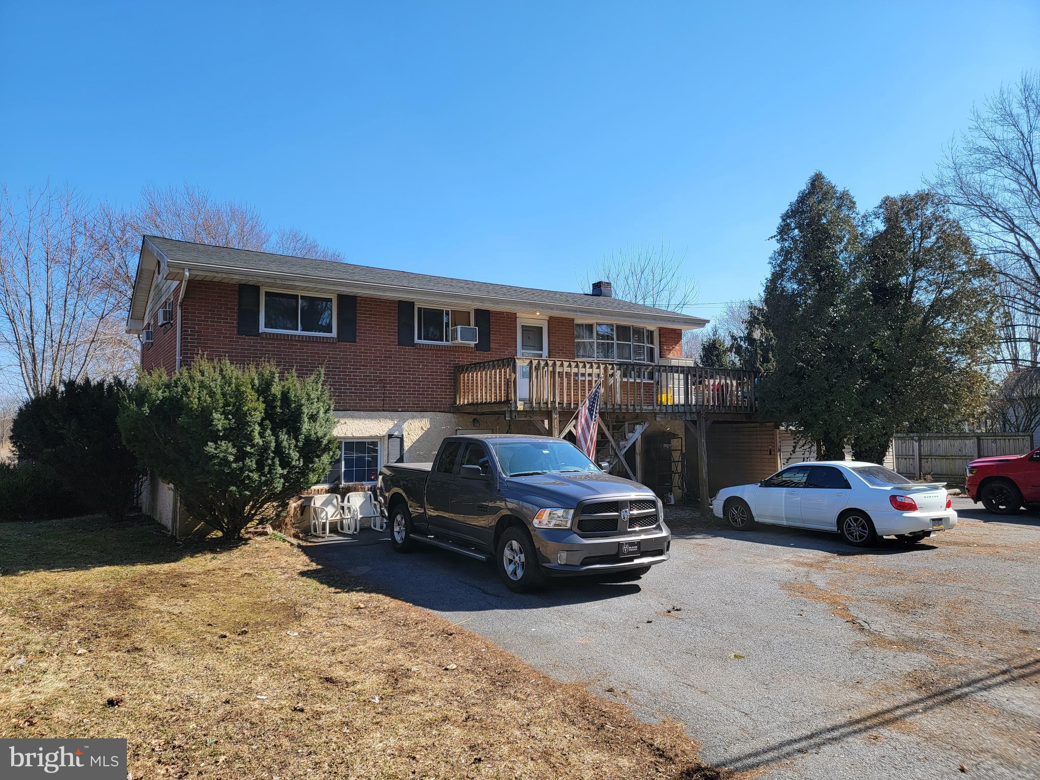 a view of a car parked in front of a house