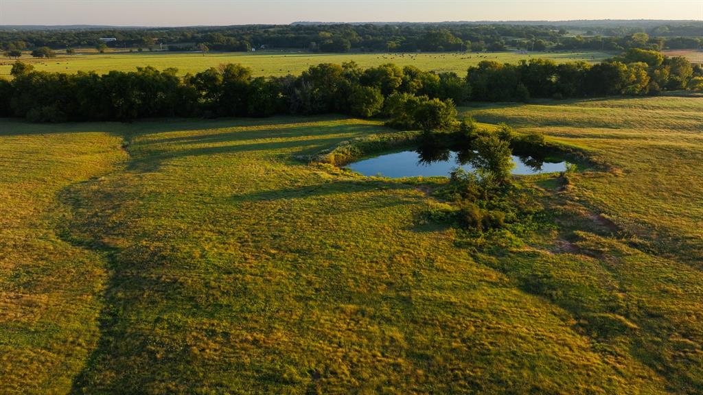 675 A Hundley Road Montague, TX 76251 - Photo 20 of 27 a view of a lake with houses in the background