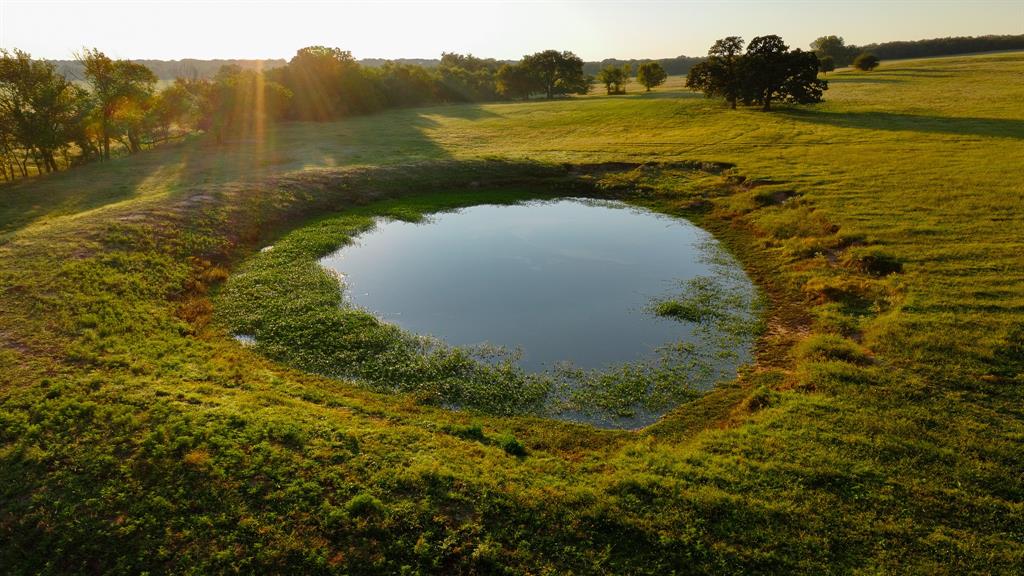 675 A Hundley Road Montague, TX 76251 - Photo 21 of 27 a view of a lake from a yard