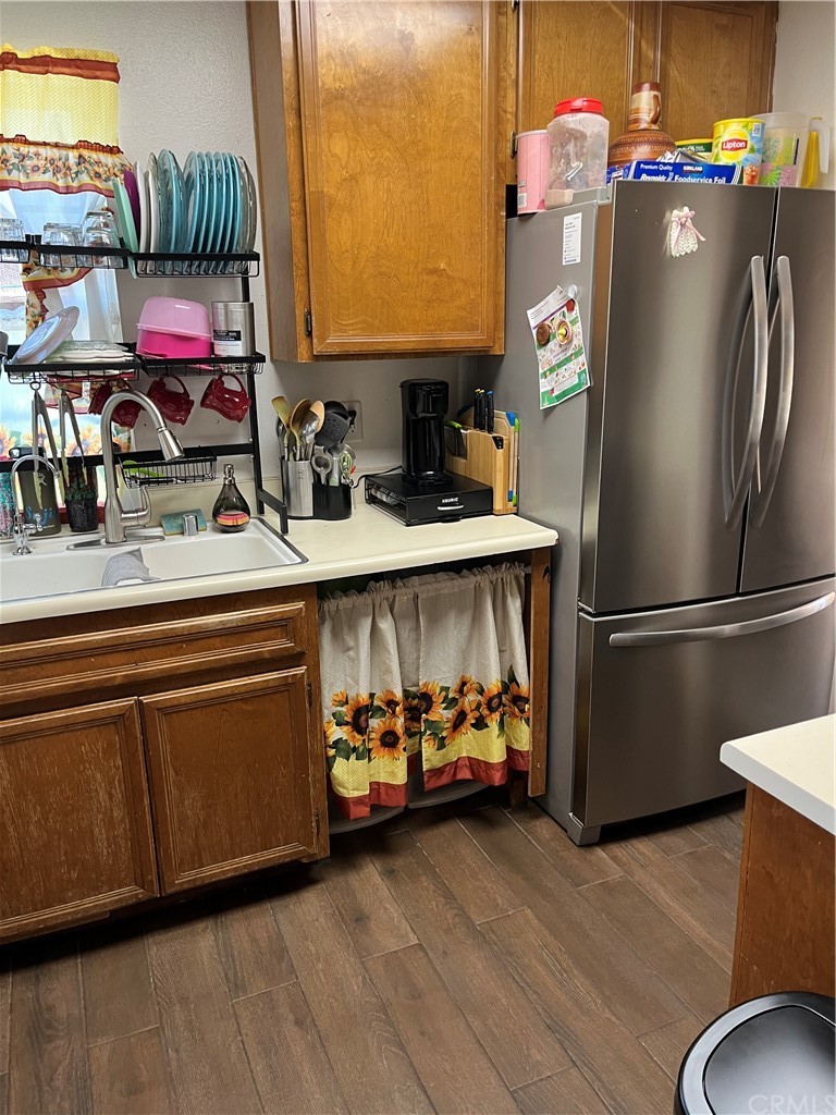 371 Redbud Place Perris, CA 92570 - Photo 14 of 27 a kitchen with stainless steel appliances granite countertop a refrigerator and a stove