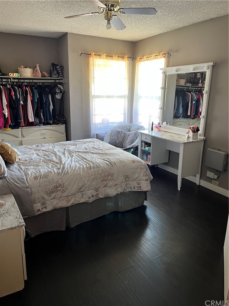 371 Redbud Place Perris, CA 92570 - Photo 23 of 27 a bedroom with a bed and a window