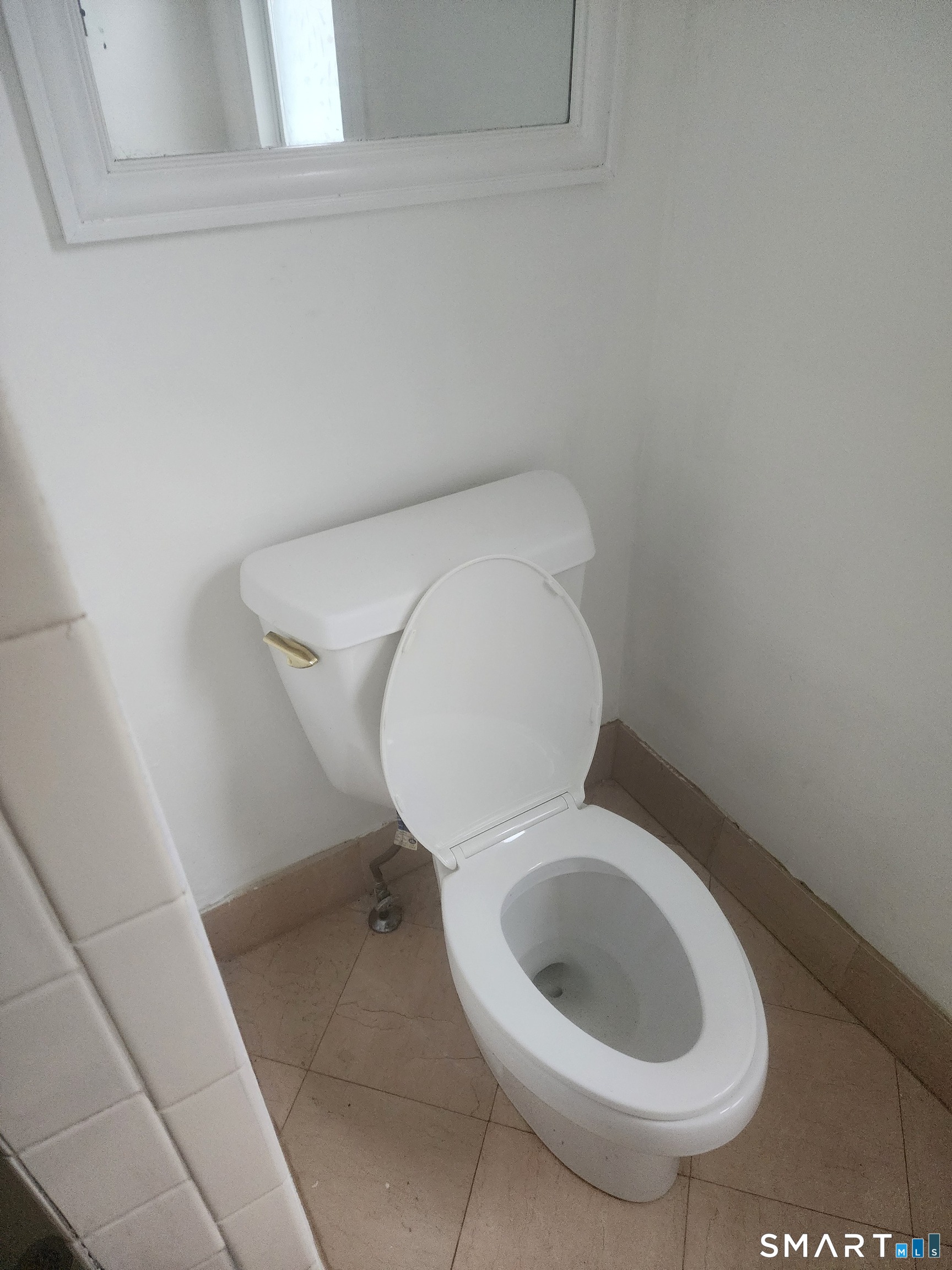 2744 Main Street Bridgeport, CT 06606 - Photo 5 of 12 a close view of a toilet in a bathroom
