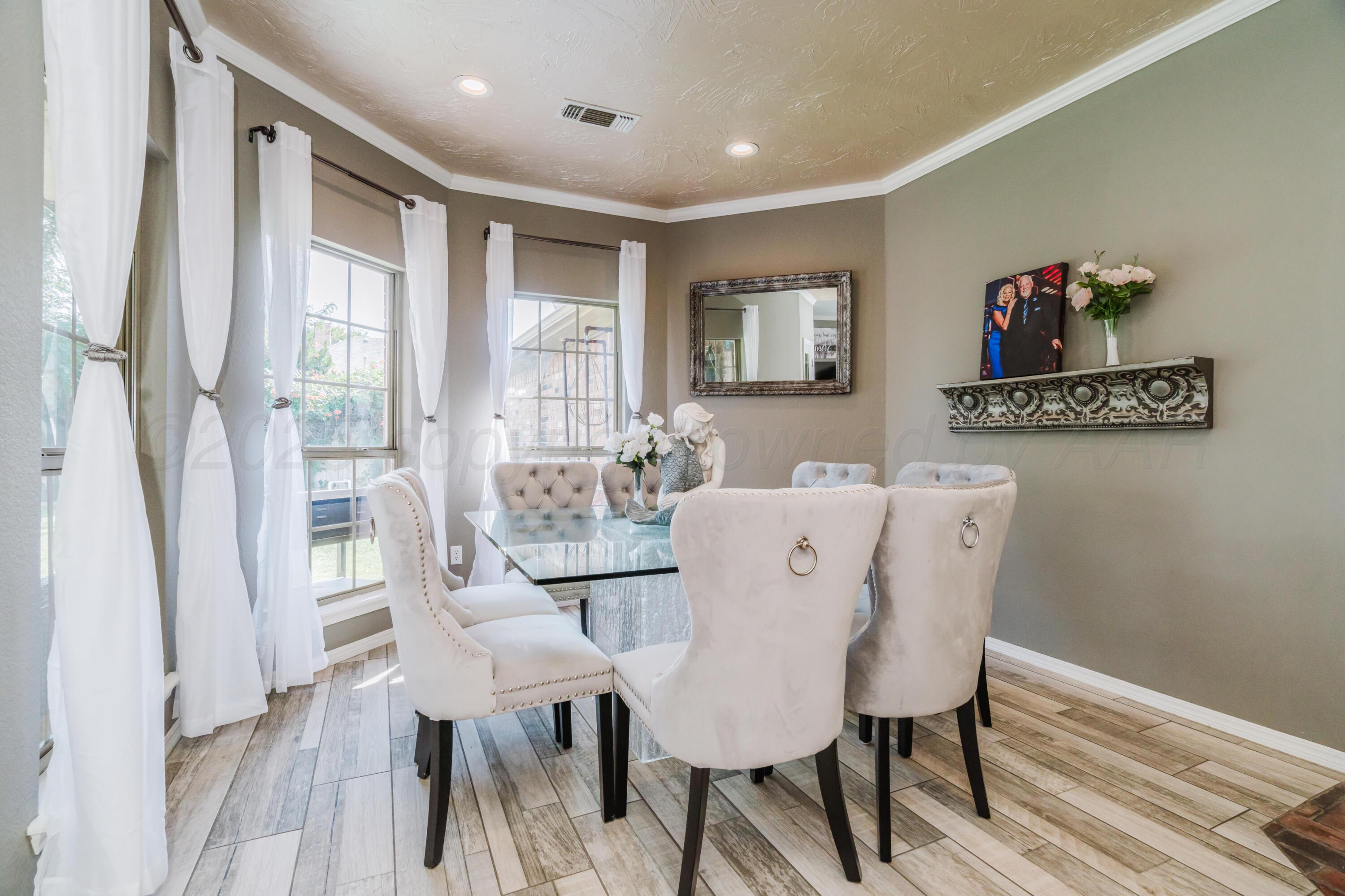 8216 Progress Drive Amarillo, TX 79119 - Photo 17 of 58 a view of a dining room with furniture window and wooden floor