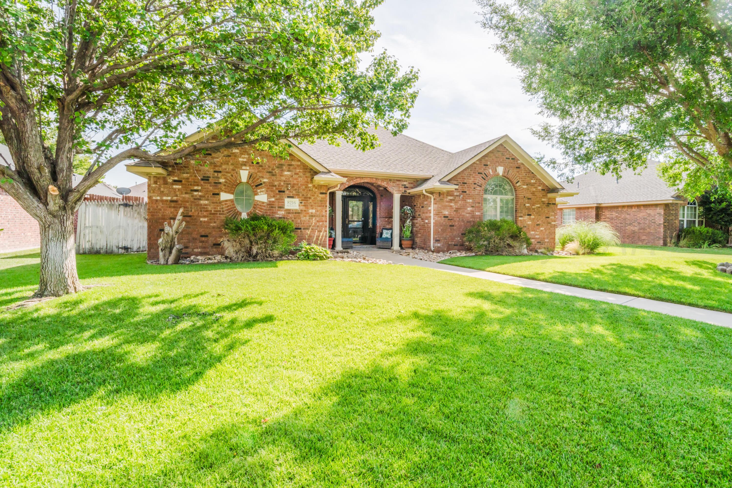 8216 Progress Drive Amarillo, TX 79119 - Photo 2 of 58 a front view of house with yard and green space