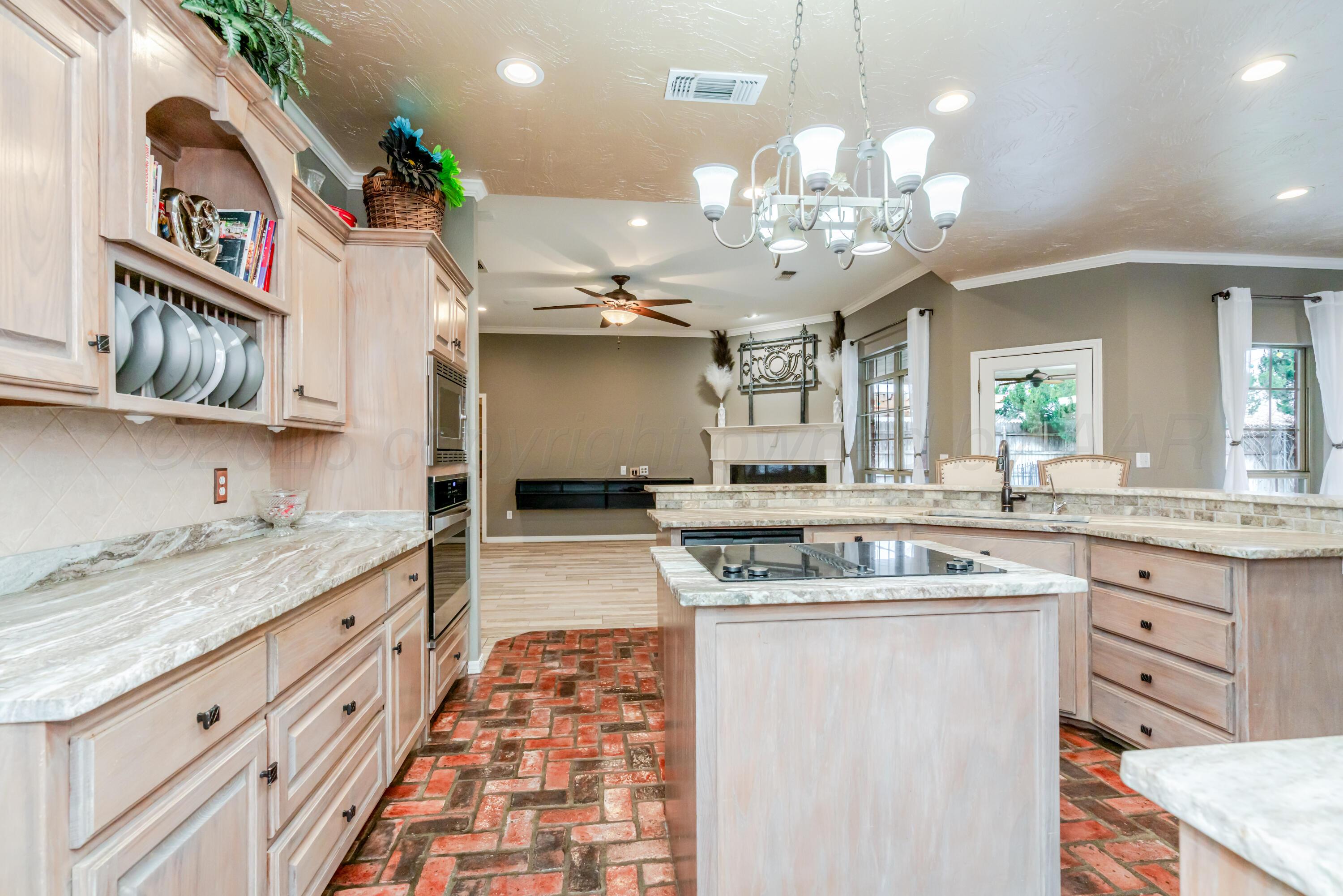 8216 Progress Drive Amarillo, TX 79119 - Photo 27 of 66 a kitchen with stainless steel appliances granite countertop a sink and cabinets
