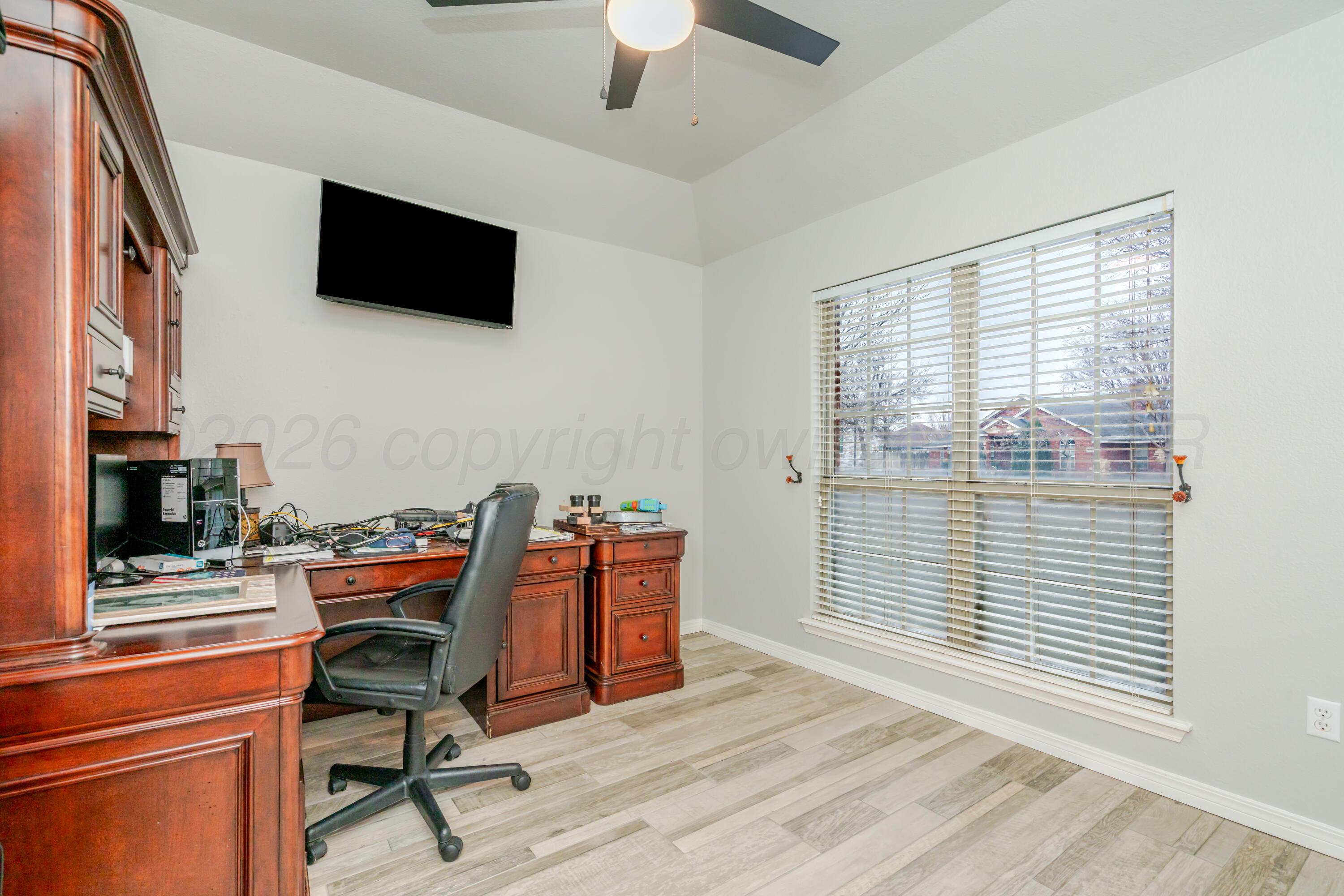 8216 Progress Drive Amarillo, TX 79119 - Photo 30 of 66 a view of a workspace with furniture and a window