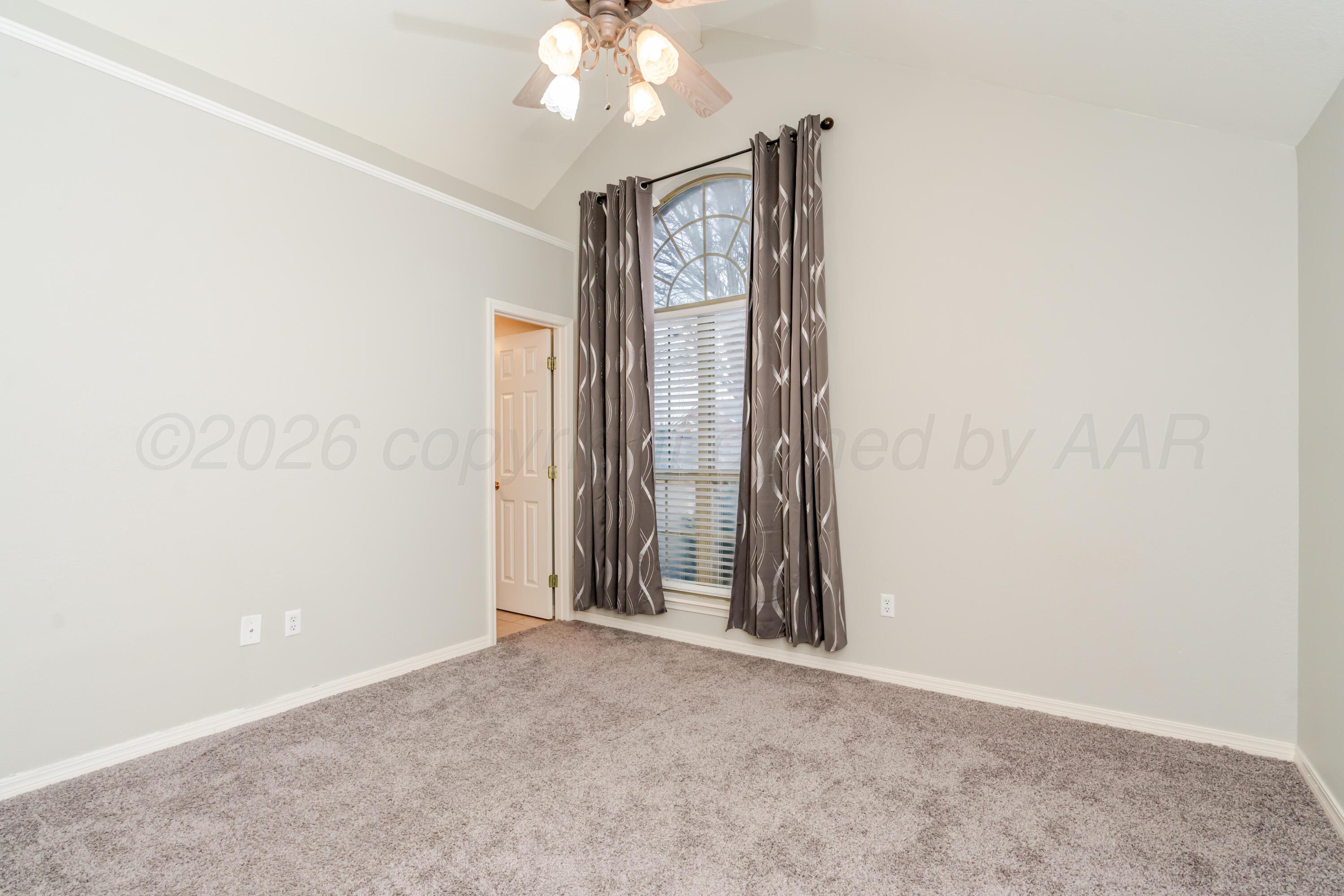 8216 Progress Drive Amarillo, TX 79119 - Photo 36 of 66 an empty room with a chandelier fan