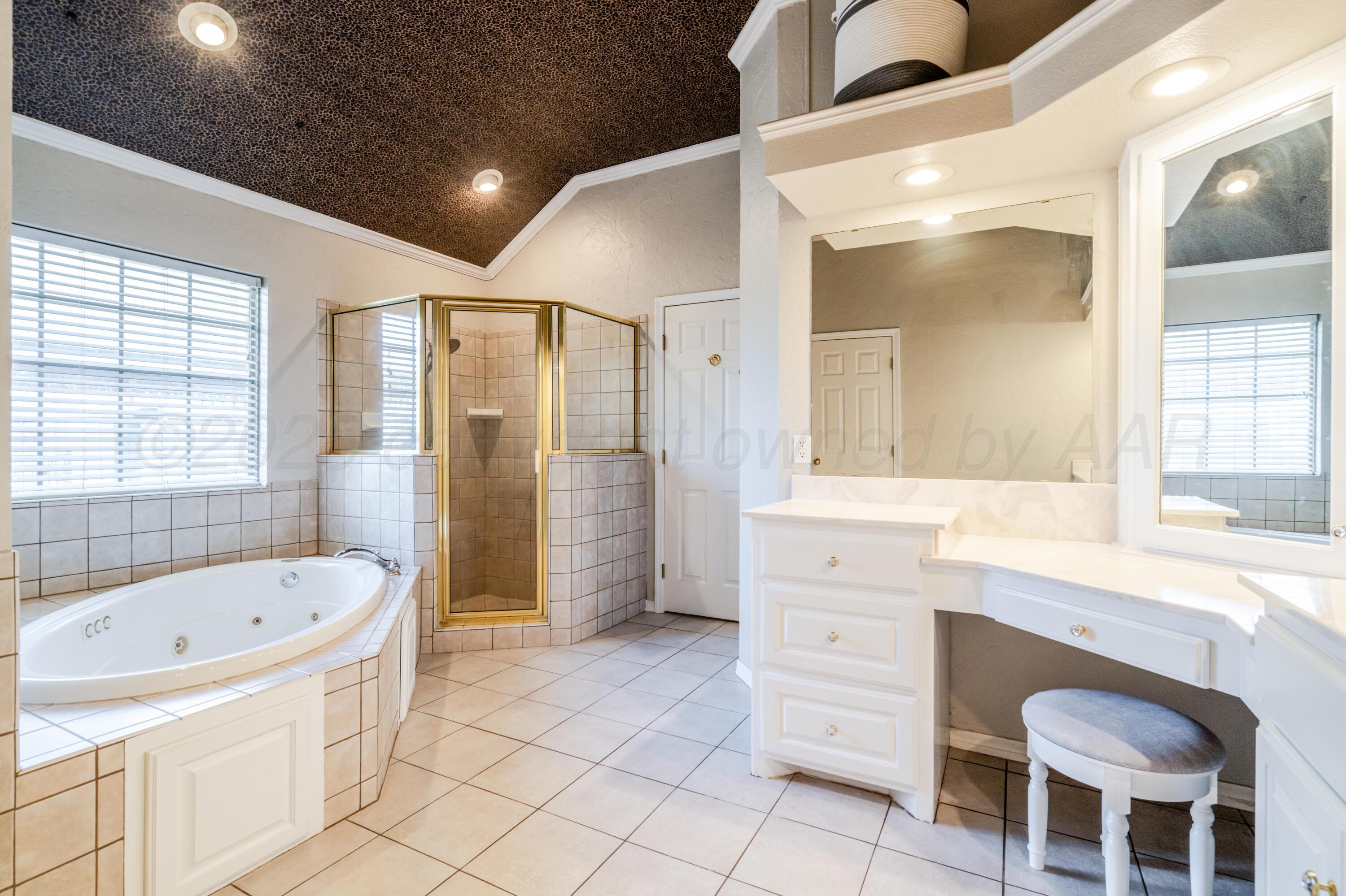 8216 Progress Drive Amarillo, TX 79119 - Photo 42 of 58 a bathroom with a bathtub sink and mirror