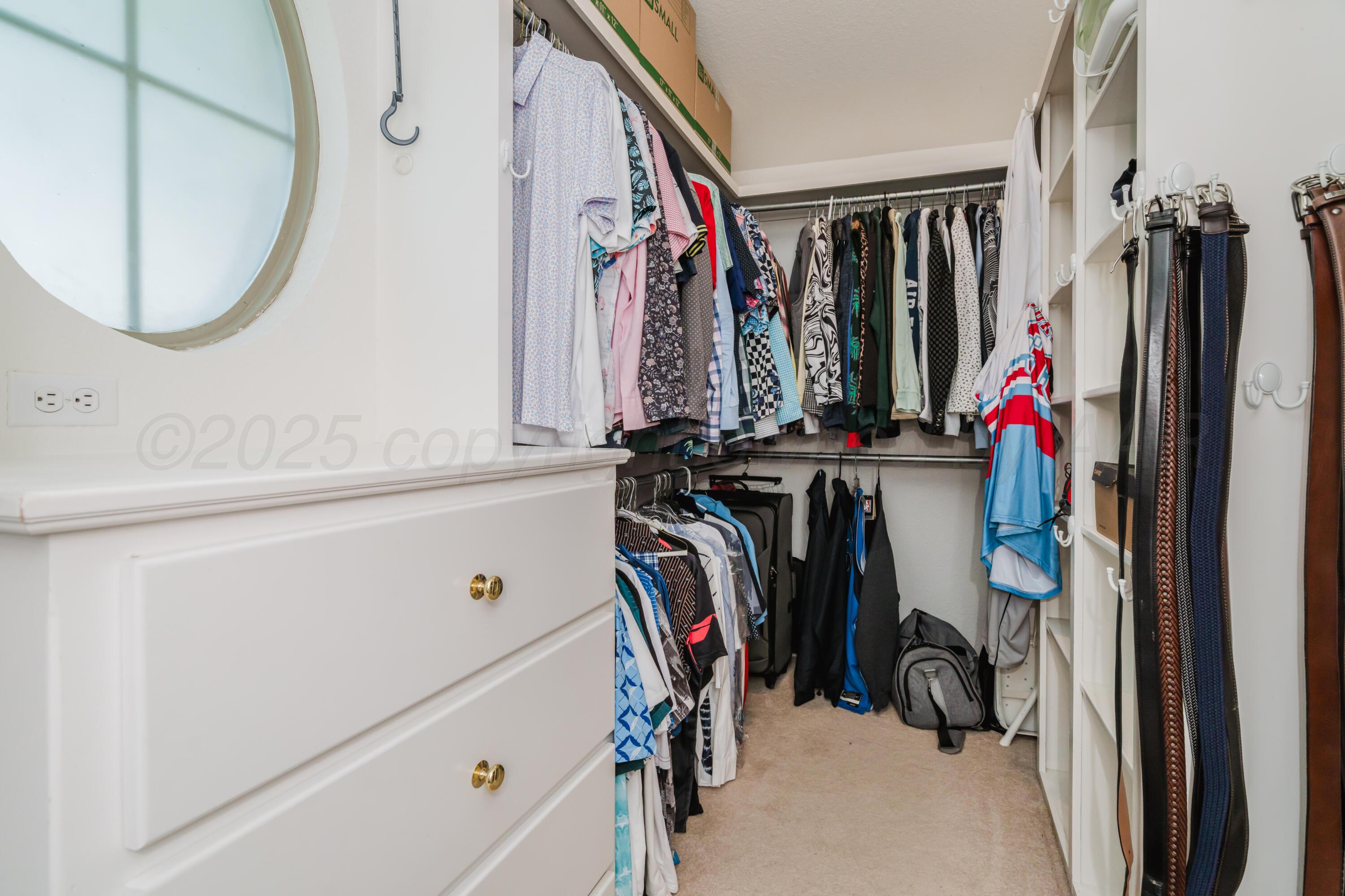 8216 Progress Drive Amarillo, TX 79119 - Photo 42 of 66 a view of walk in closet with clothes