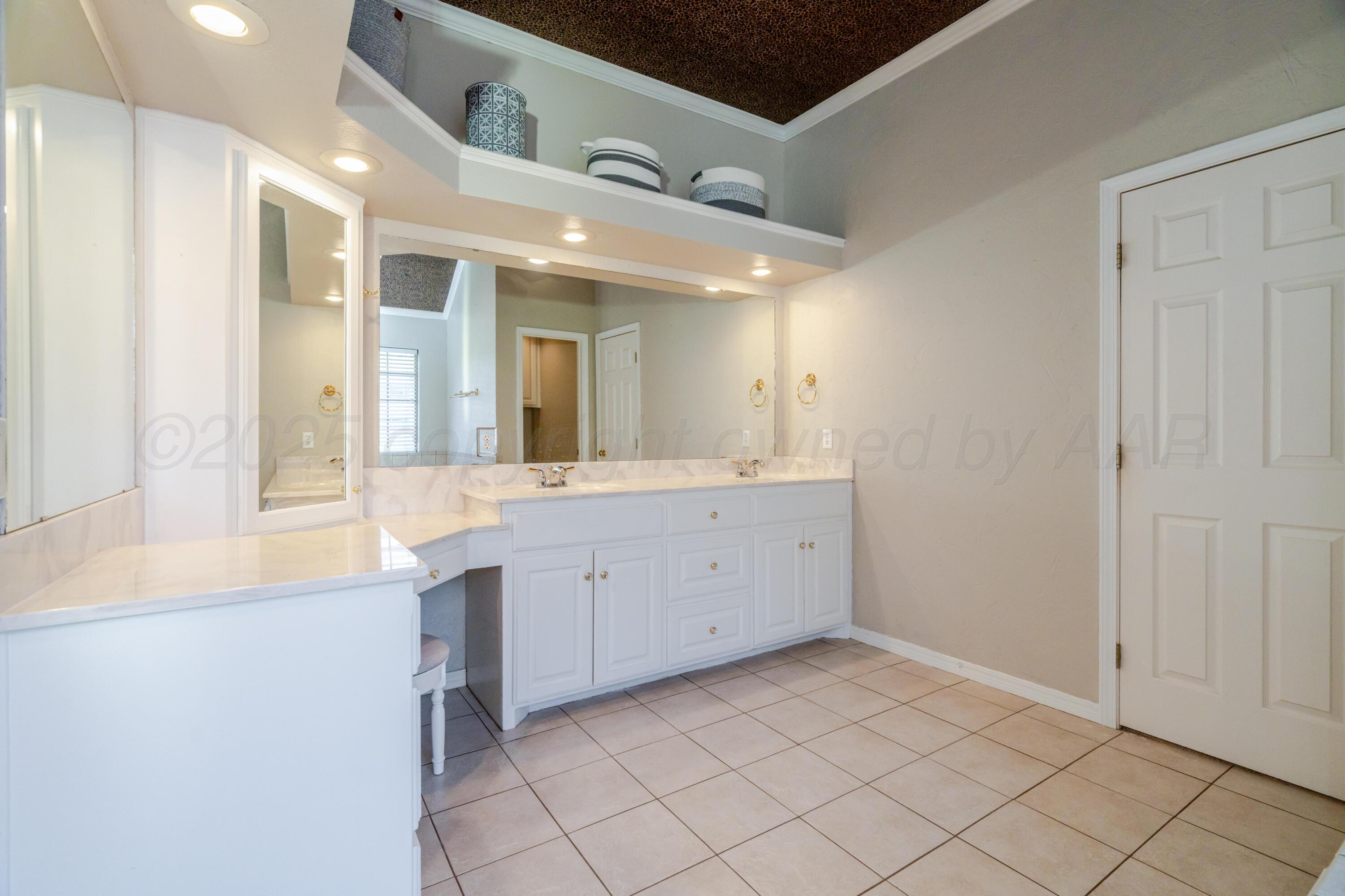 8216 Progress Drive Amarillo, TX 79119 - Photo 45 of 58 a spacious bathroom with a double vanity sink mirror and