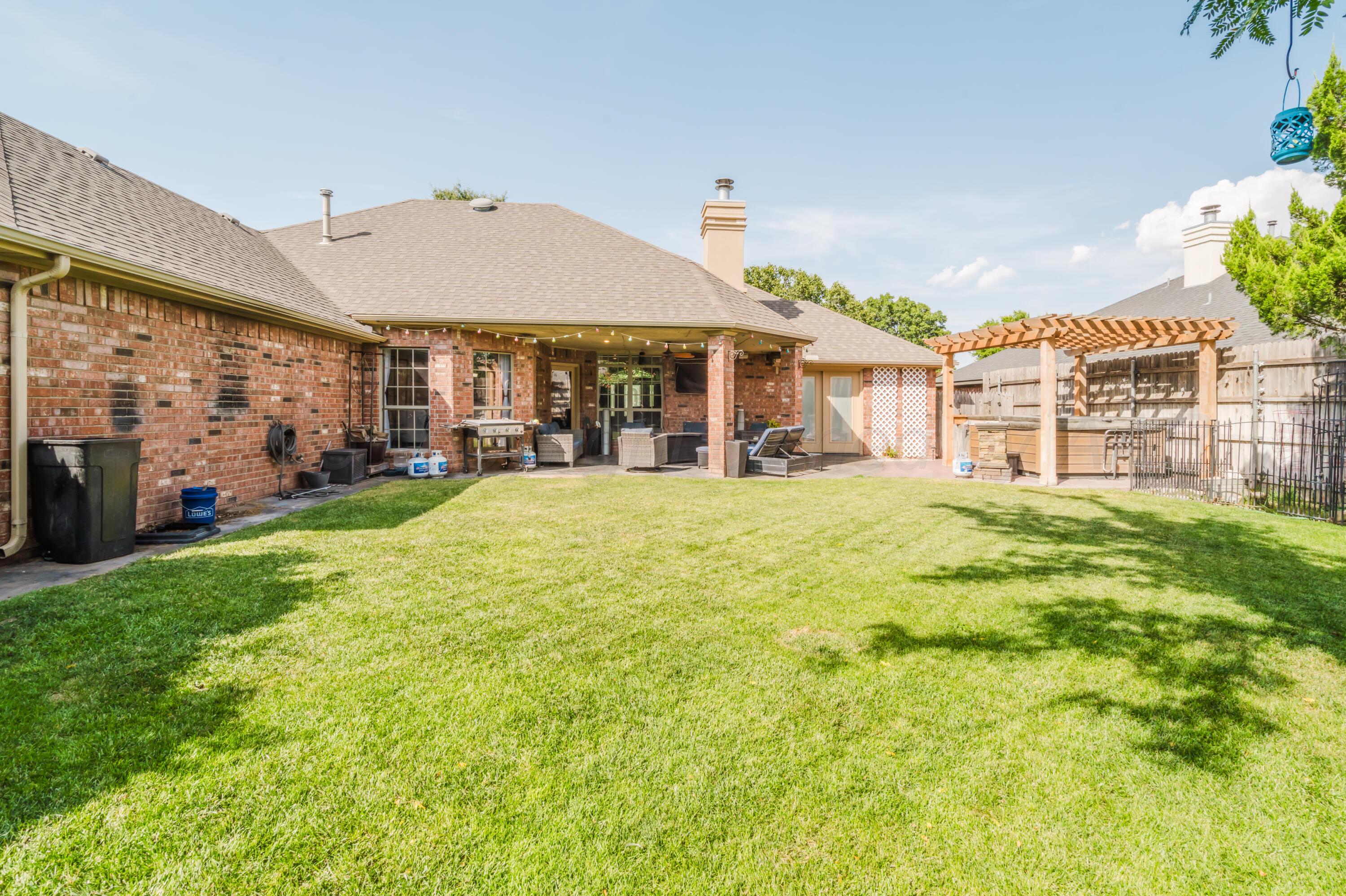 8216 Progress Drive Amarillo, TX 79119 - Photo 58 of 66 a view of a house with a big yard and potted plants