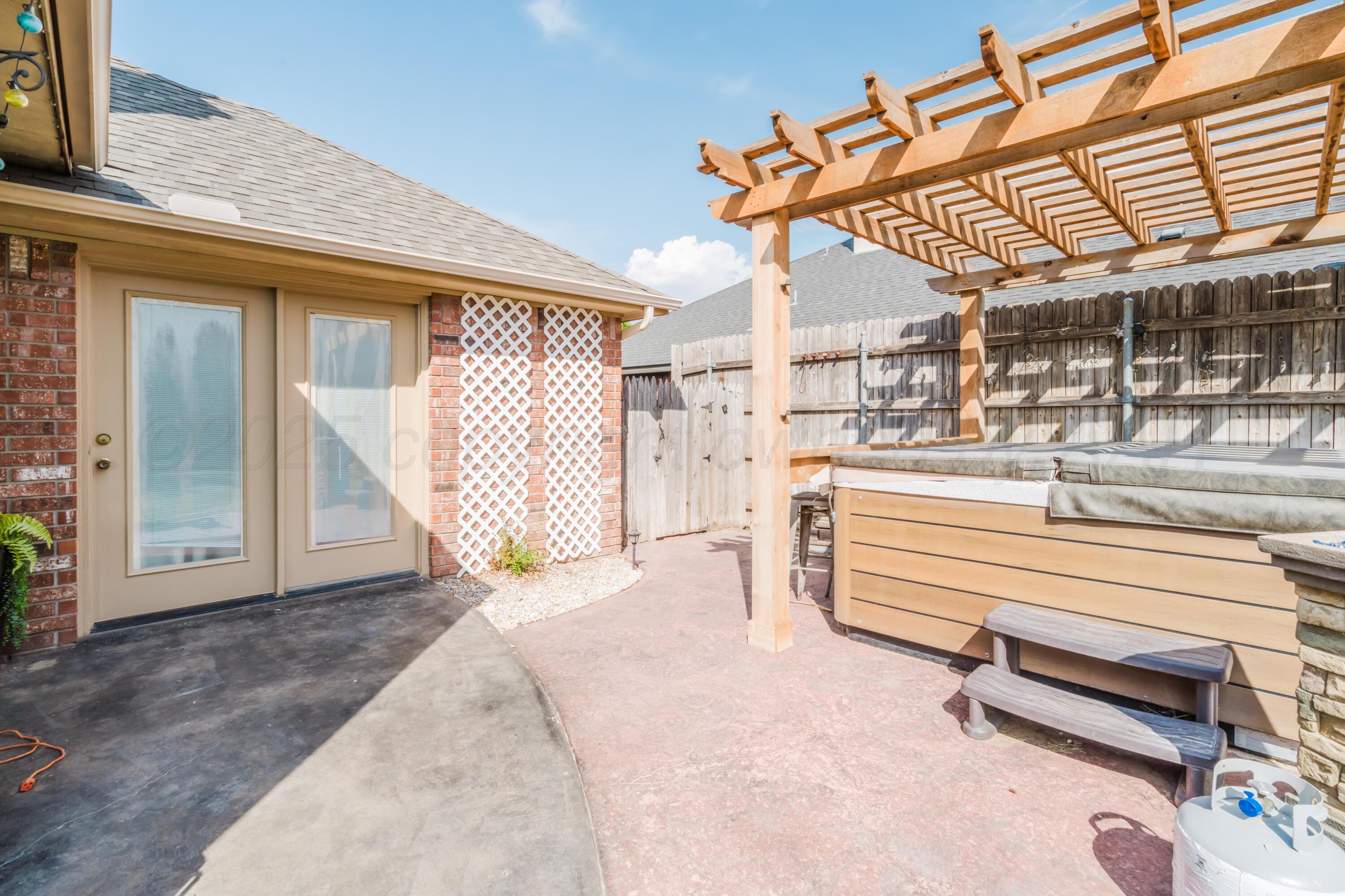 8216 Progress Drive Amarillo, TX 79119 - Photo 60 of 66 a view of a backyard with a wooden deck