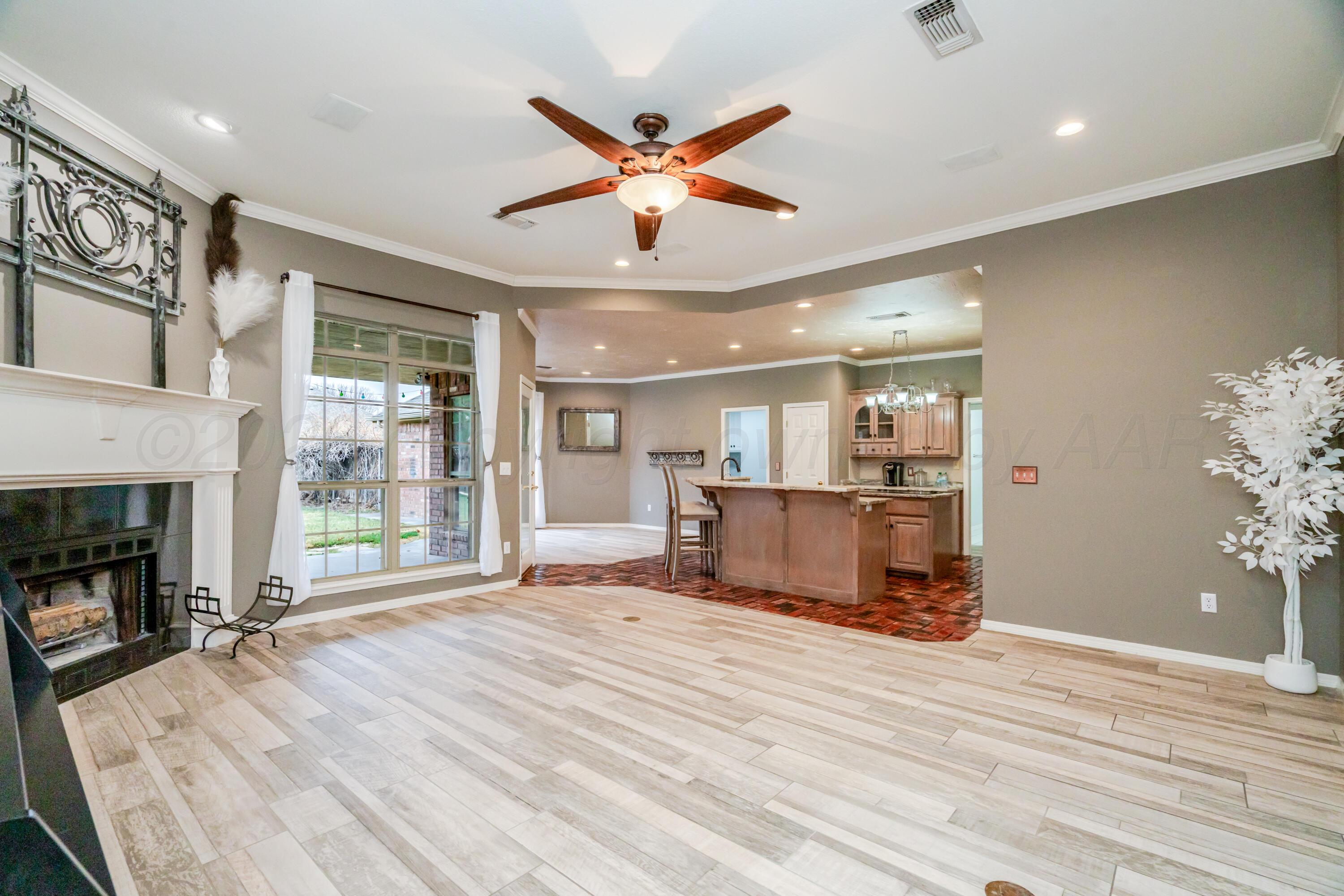 8216 Progress Drive Amarillo, TX 79119 - Photo 65 of 66 a view of livingroom with hardwood floor and a ceiling fan