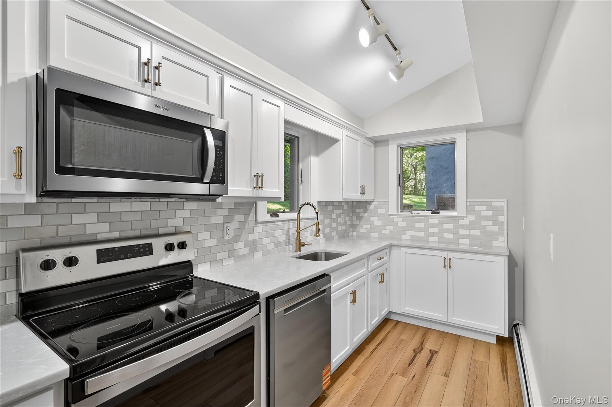 91 Sleepy Valley Road Warwick, NY 10990 - Photo 9 of 30 a kitchen with granite countertop a stove microwave and sink