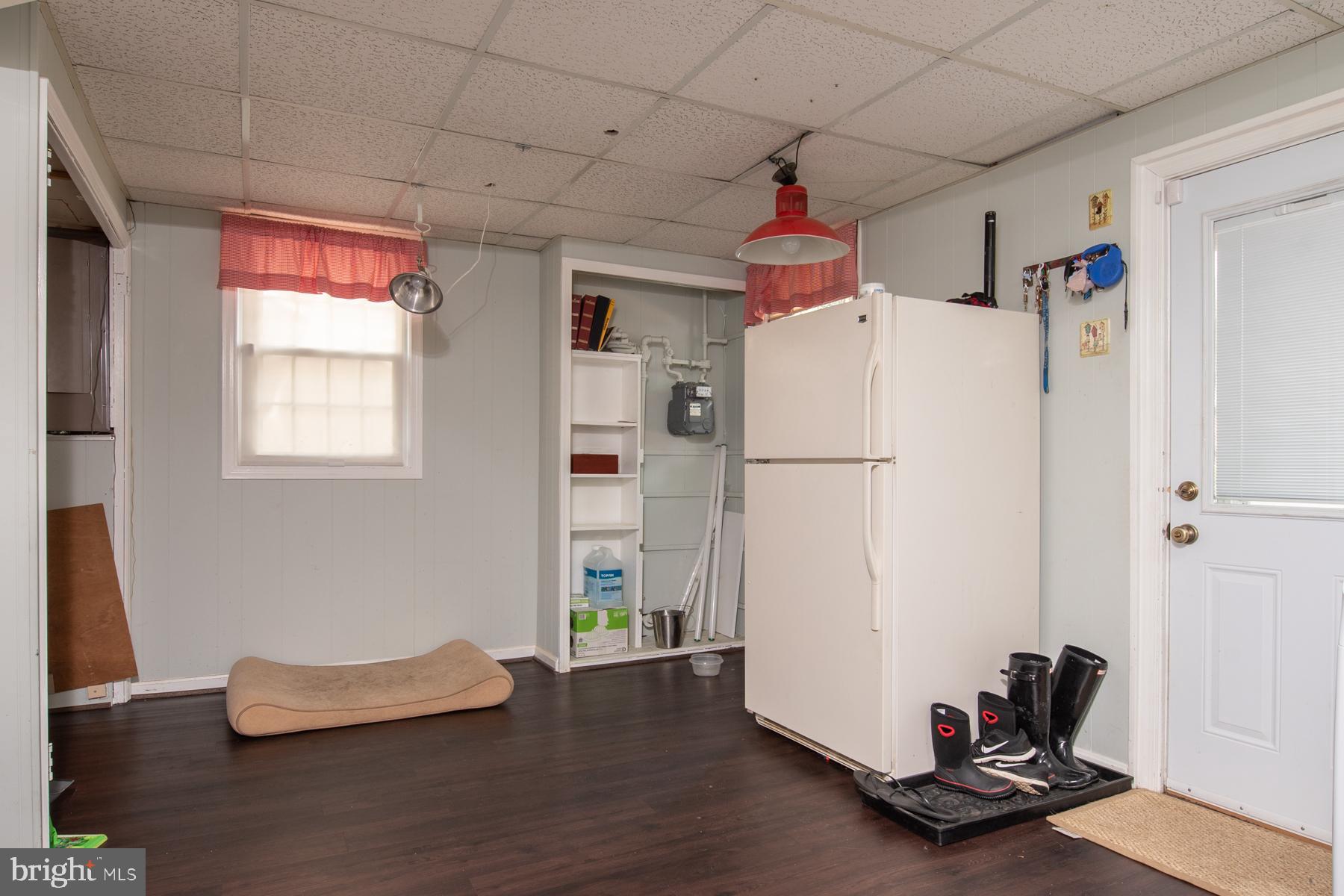 8425 Fort Hunt Road Alexandria, VA 22308 - Photo 15 of 24 rear mud room with laundry and spare refrigerator