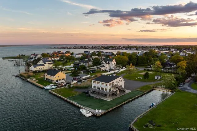 an aerial view of a house with a ocean view