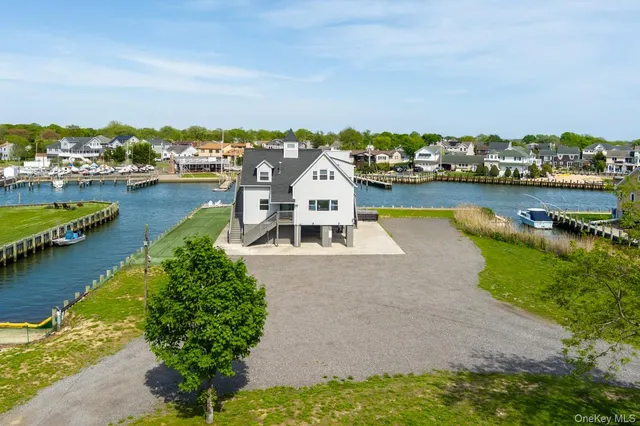 an aerial view of a house with lake view