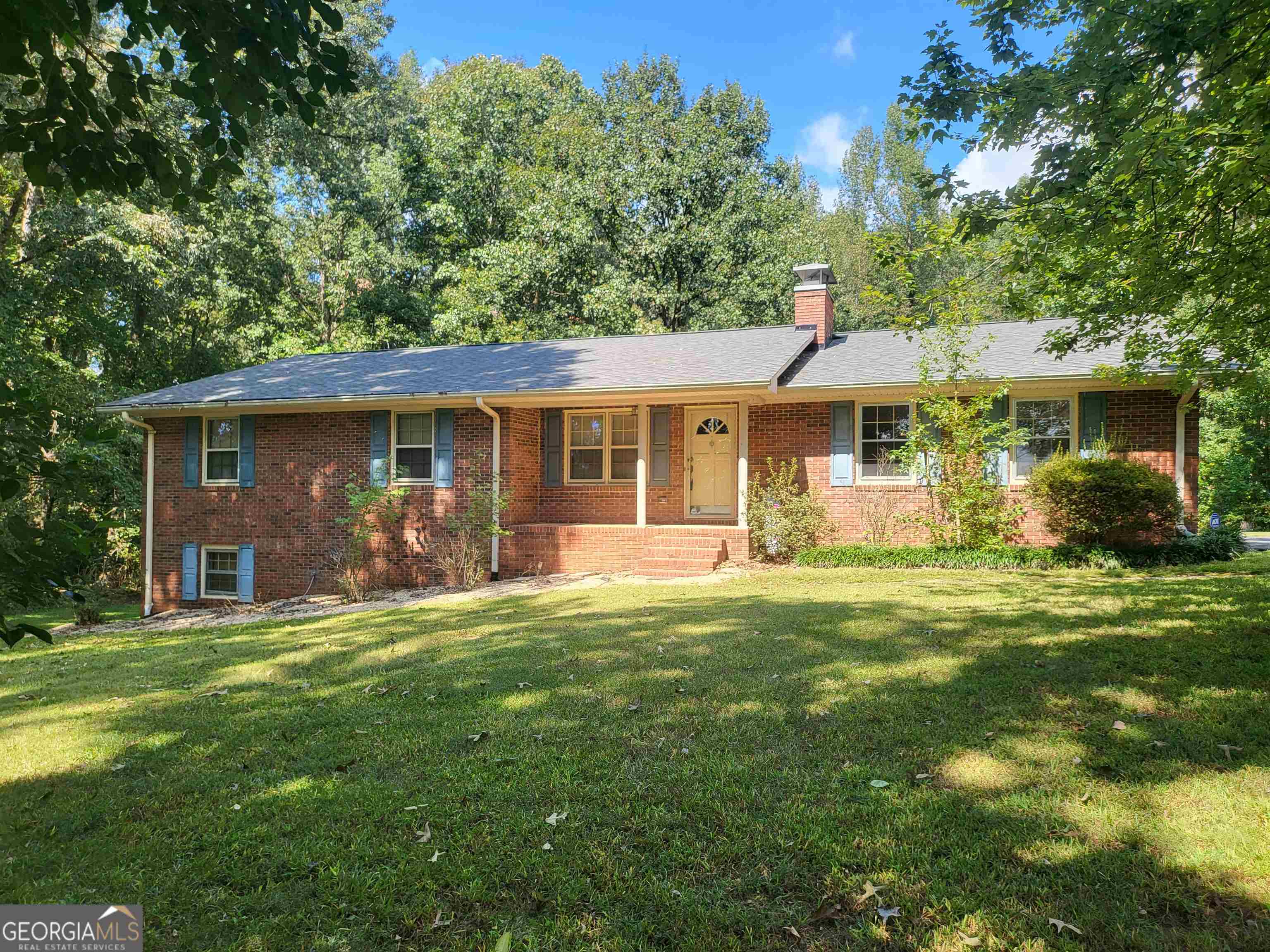 207 Highway 172 Colbert, GA 30628 - Photo 1 of 1 a front view of a house with a garden