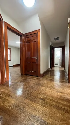 an empty room with windows and closet